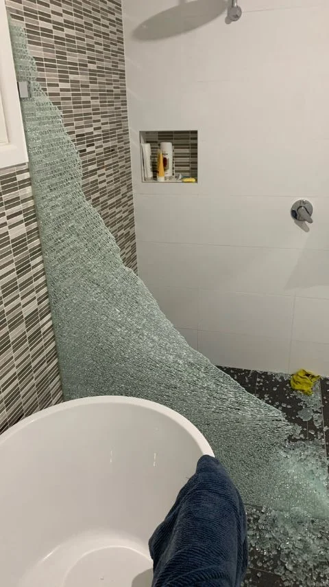 The frameless glass panel shattered from the wrong installation.