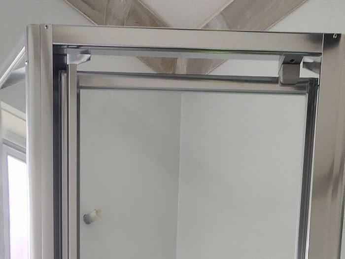 Close view of a full aluminium frame and pivot hinge in Edmondson Park
