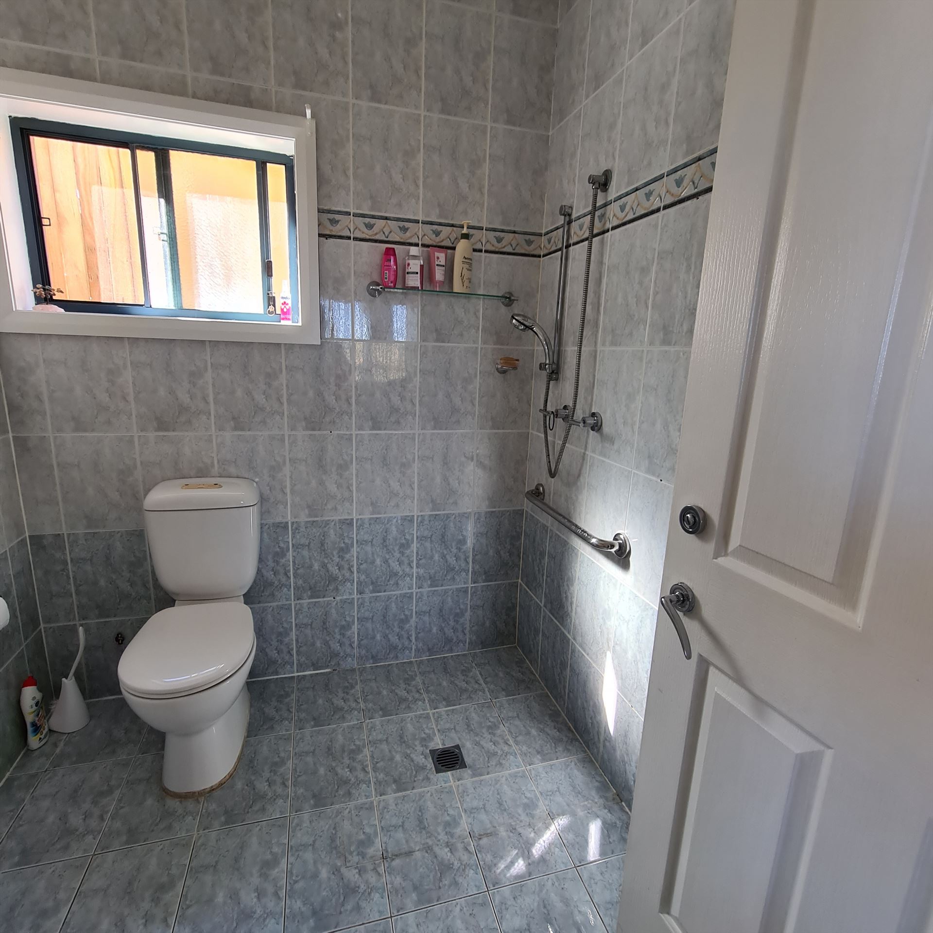 Bathroom before frameless shower screen install in Carlton