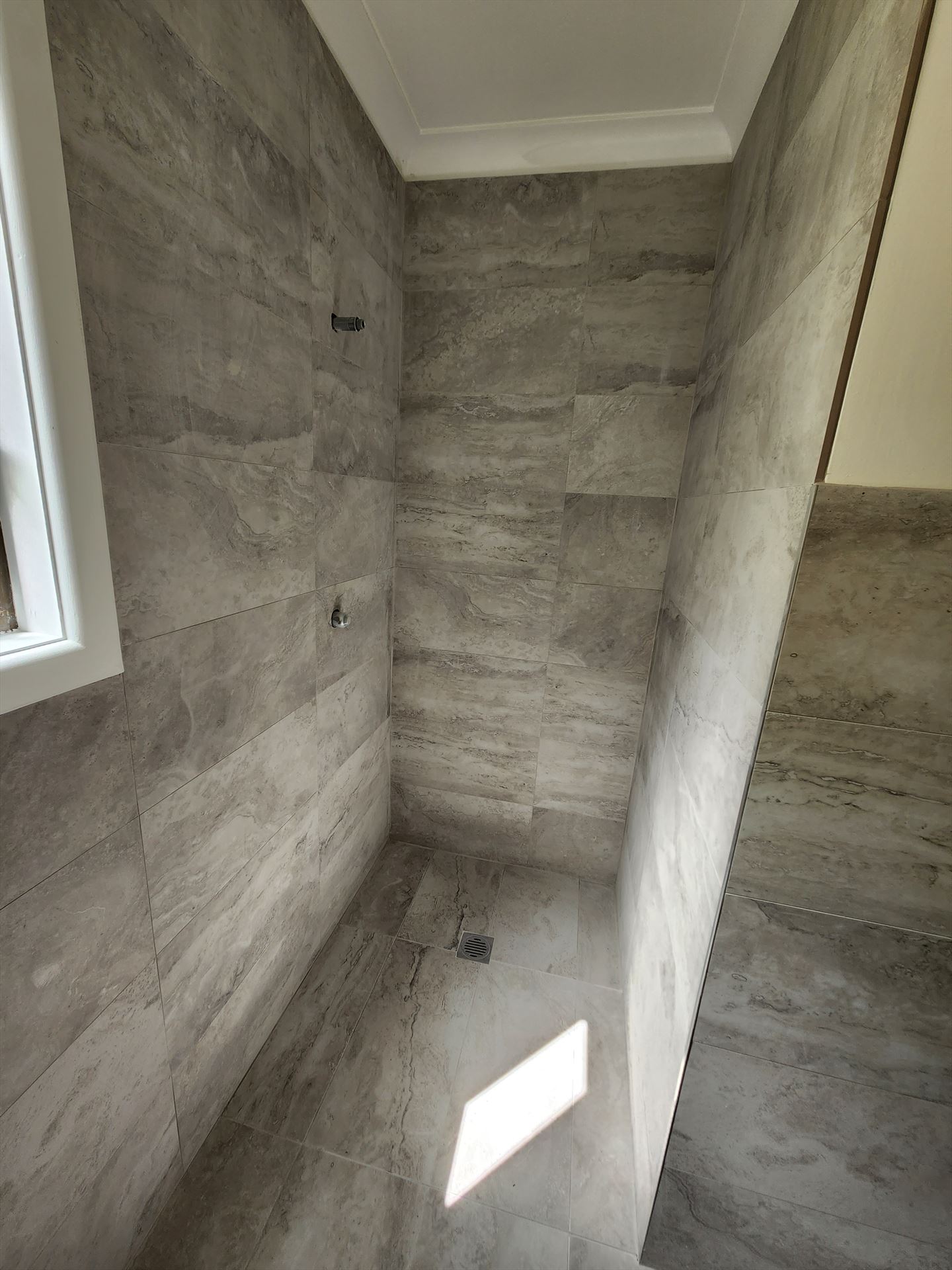 Bathroom before frameless shower screen install in Revesby Heights