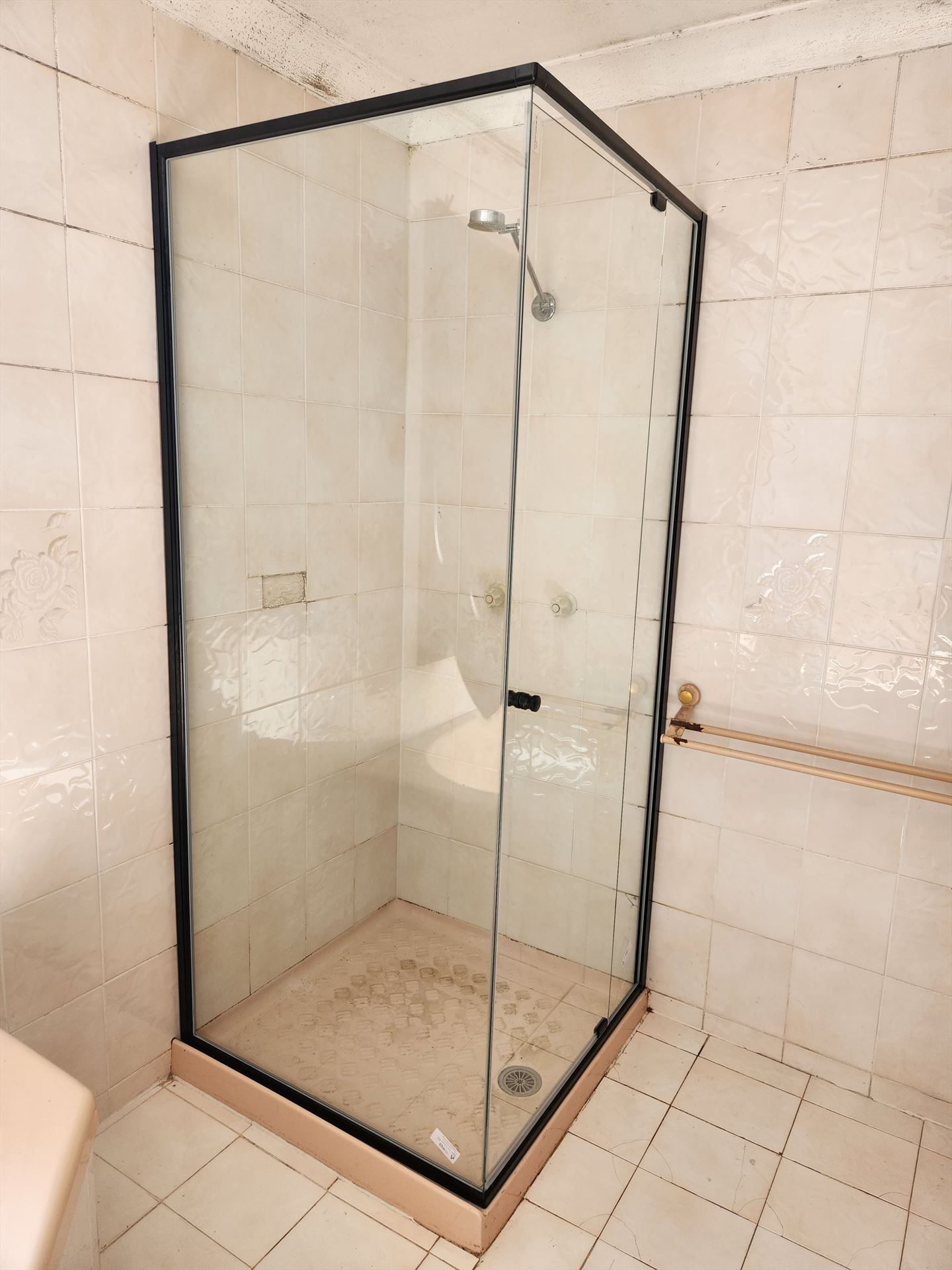 semi shower screen with black hardware installed in Auburn by Showerland