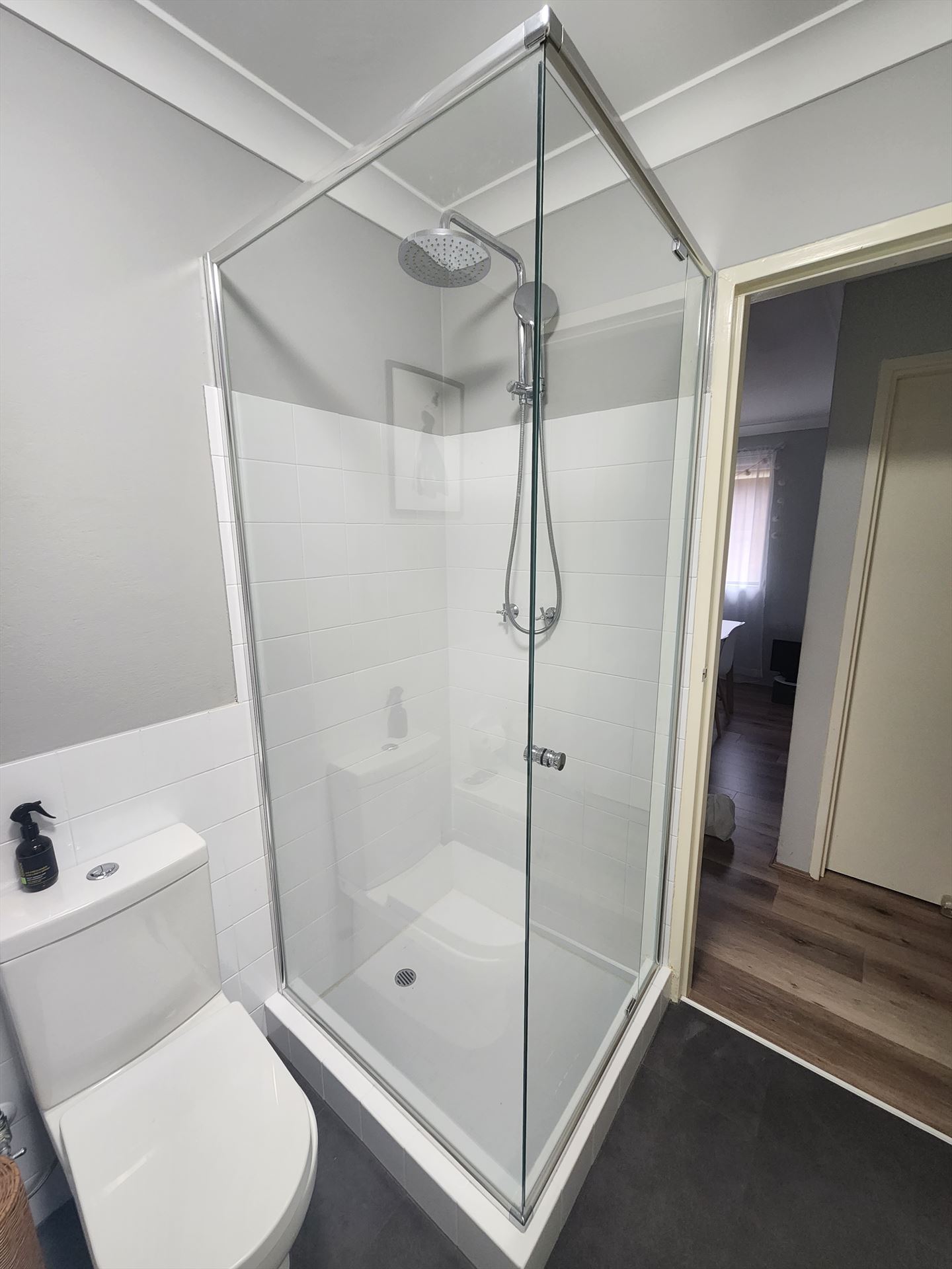 shower screen with chrome hardware installed in Telopea by Showerland