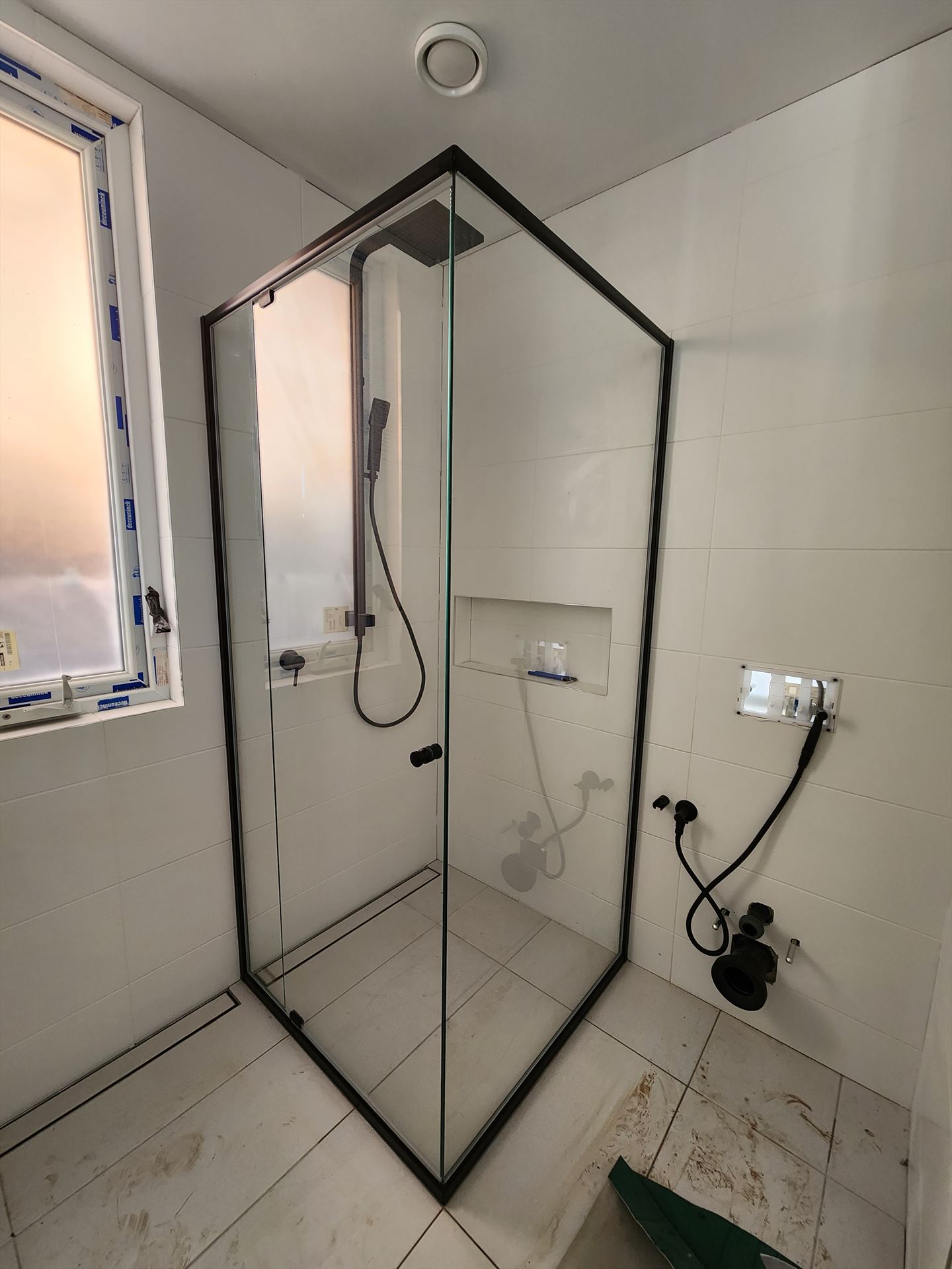 semi shower screen with black hardware installed in Roselands by Showerland