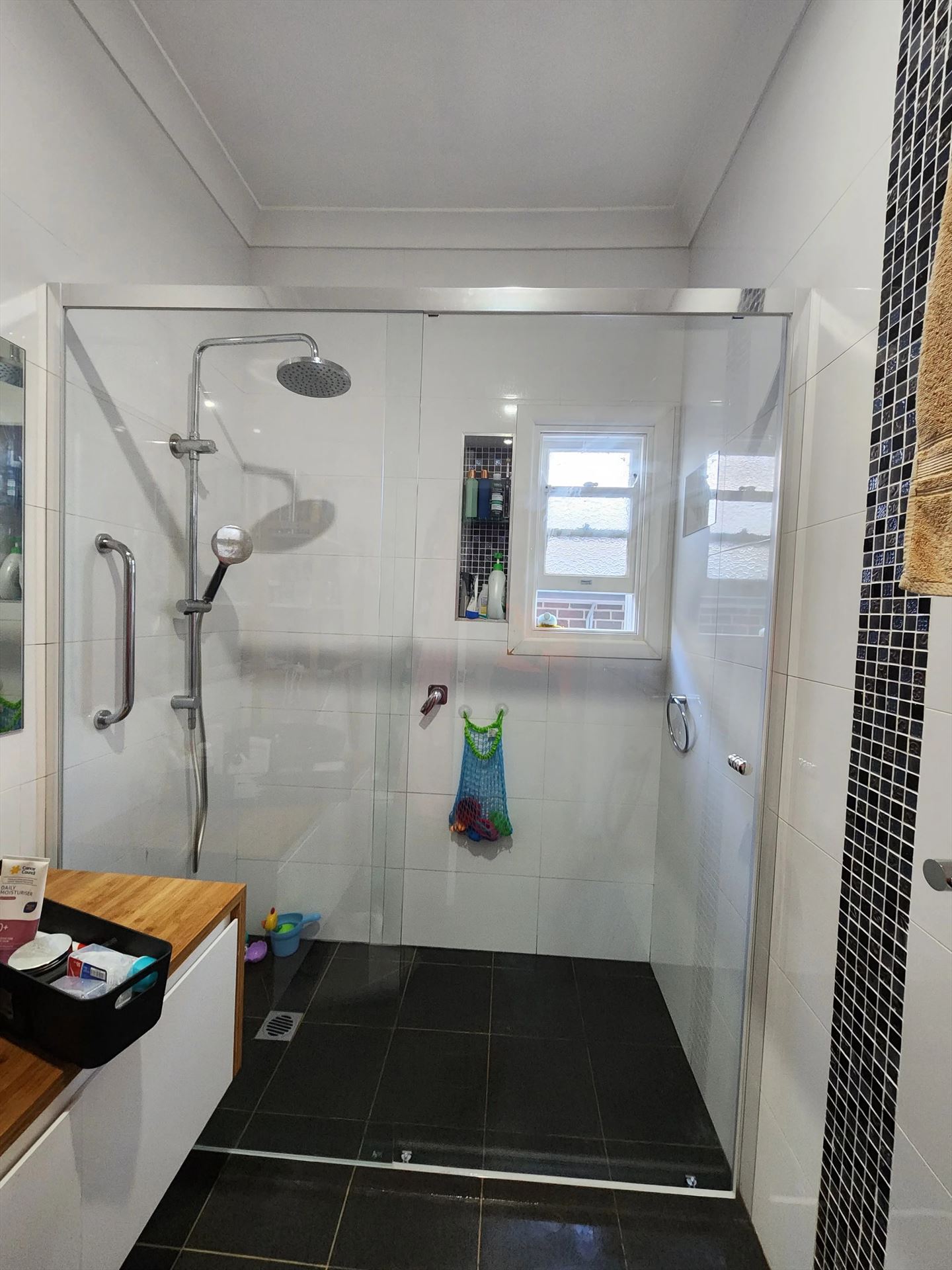 semi shower screen with chrome hardware installed in Melrose Park by Showerland