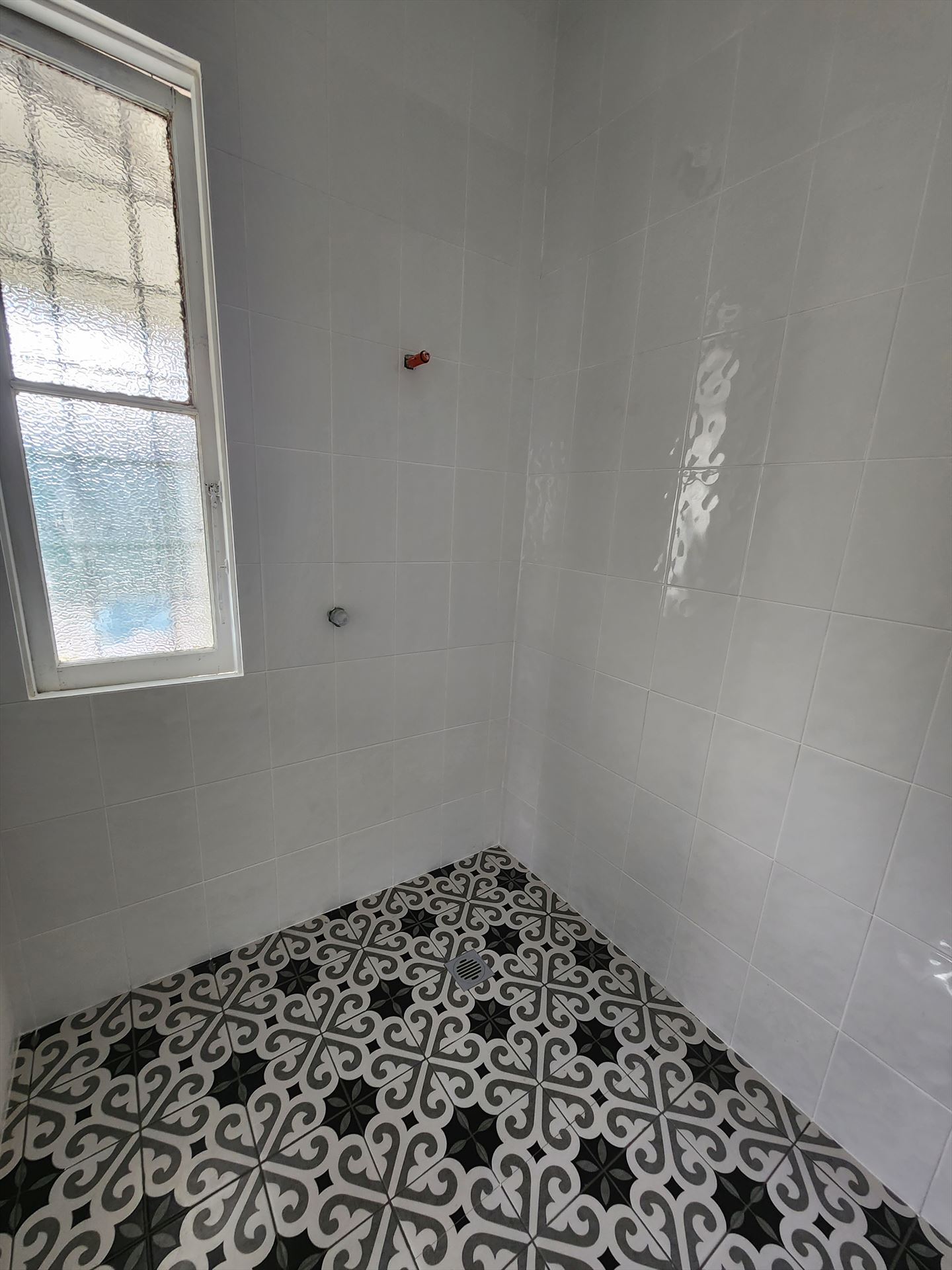 Bathroom before frameless shower screen install in Strathfield