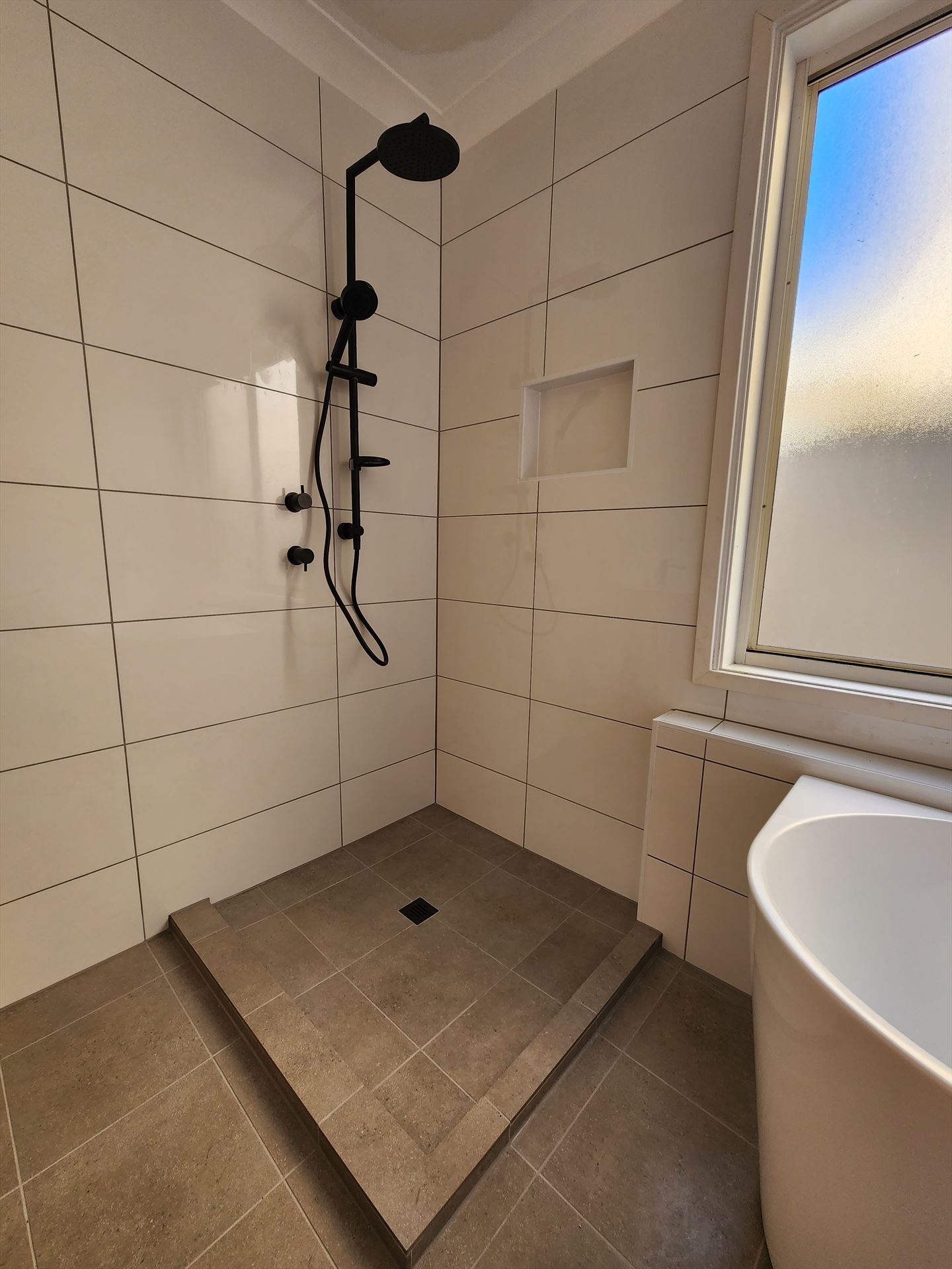 Bathroom before frameless shower screen install in Cabramatta West