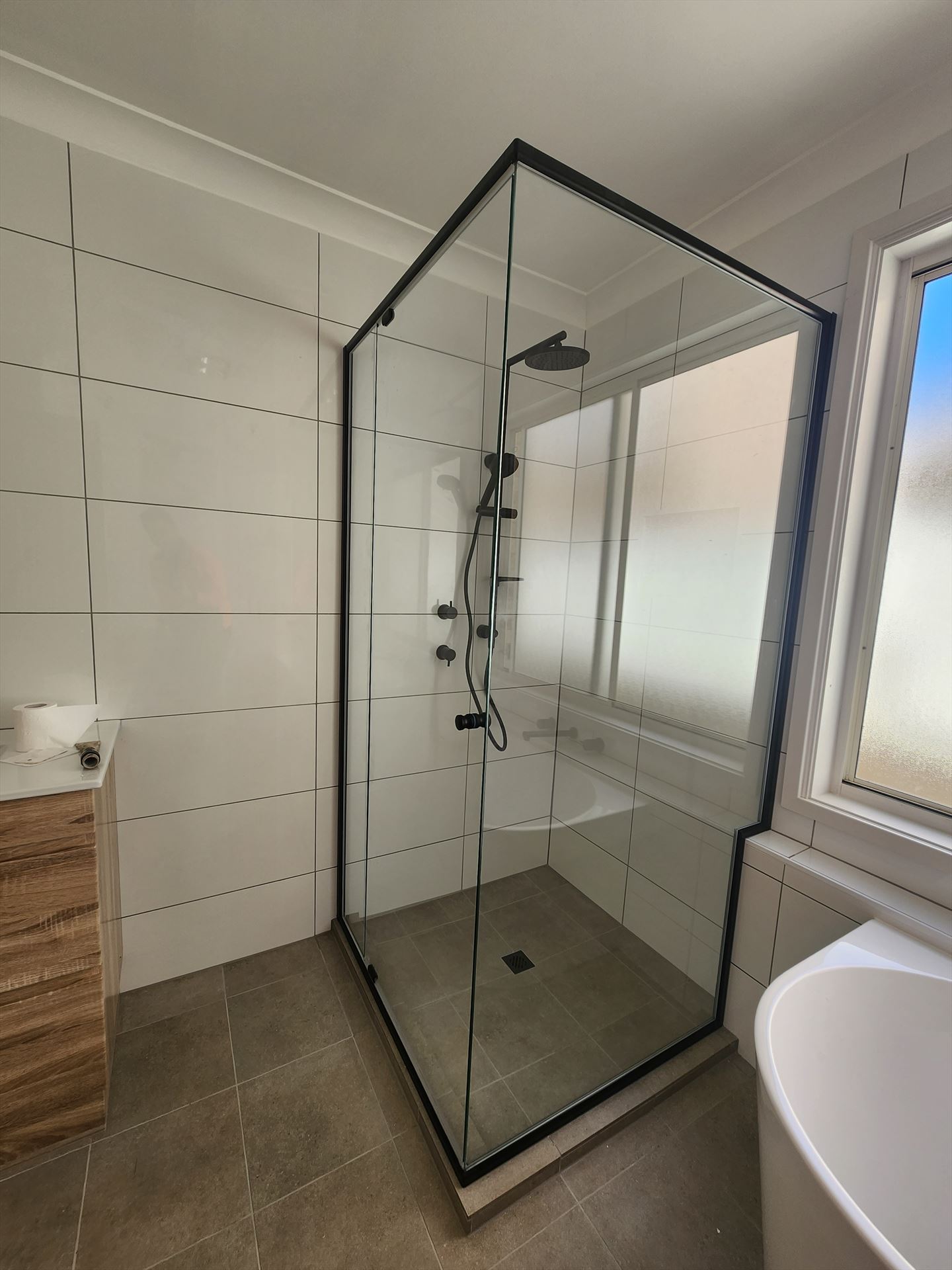 semi shower screen with black hardware installed in Cabramatta West by Showerland