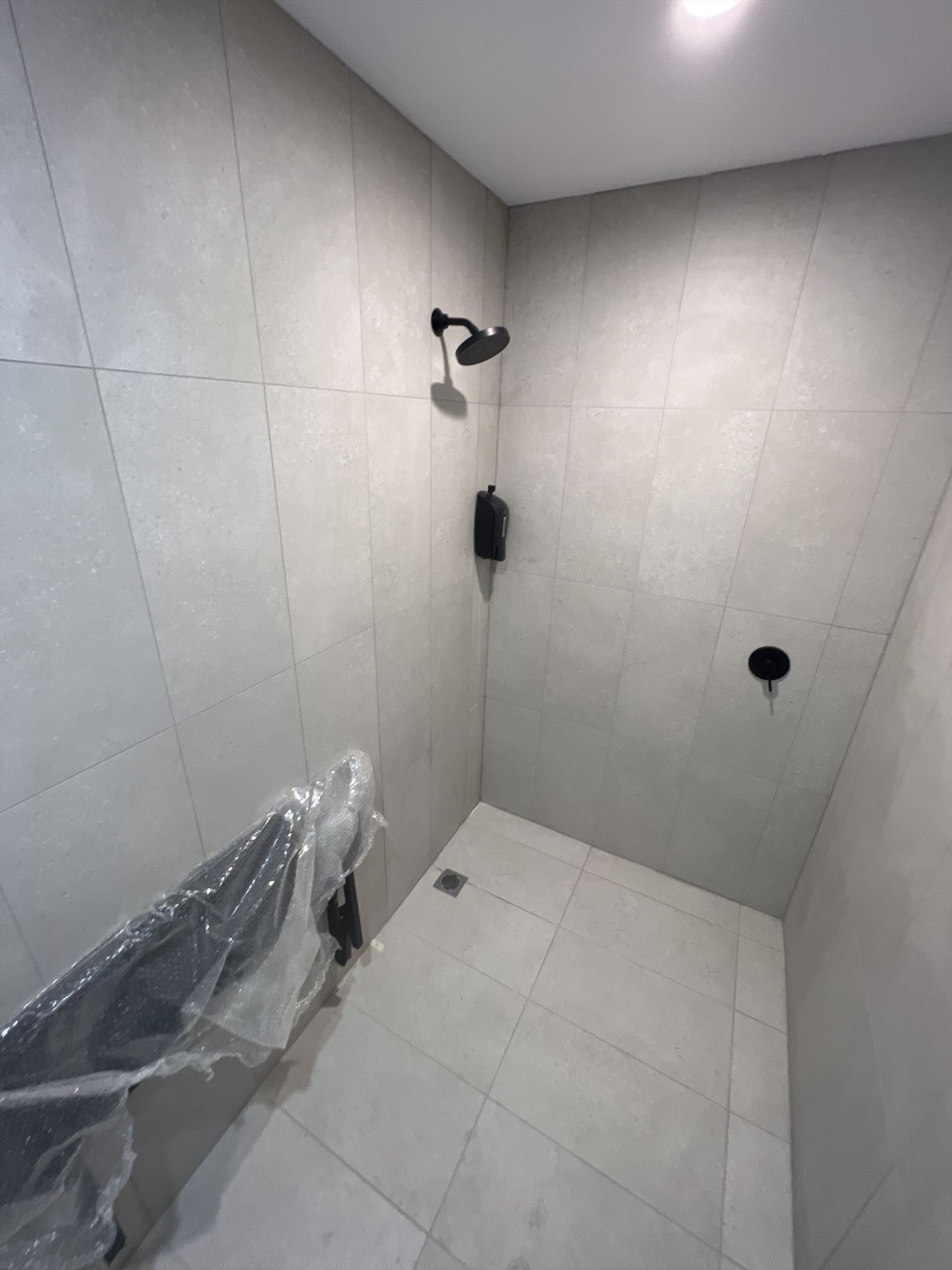 Bathroom before frameless shower screen install in Warilla
