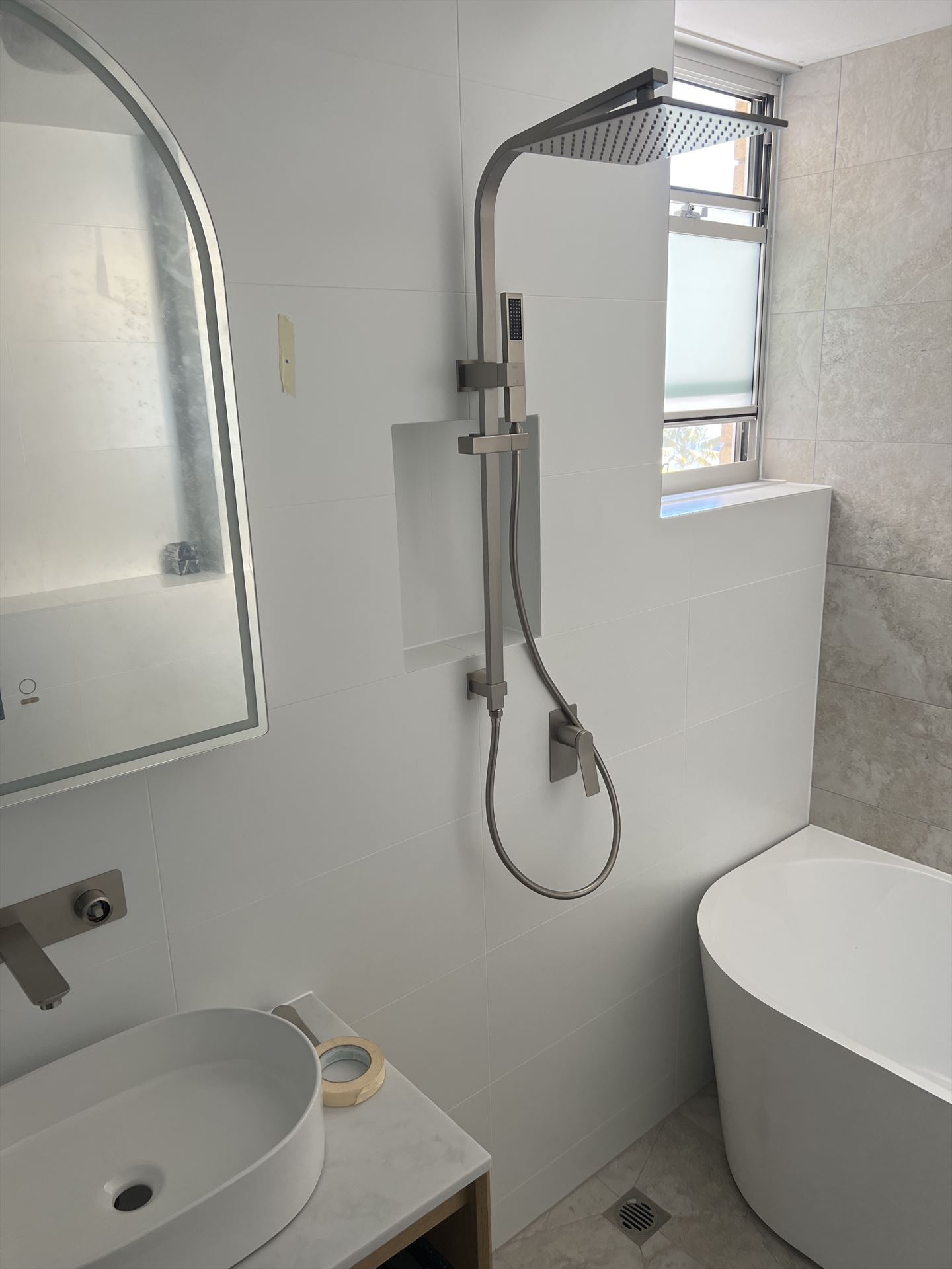 Bathroom before frameless shower screen install in Mosman