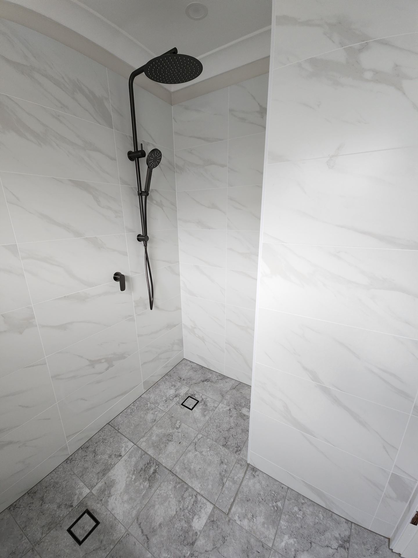 Bathroom before frameless shower screen install in Menai