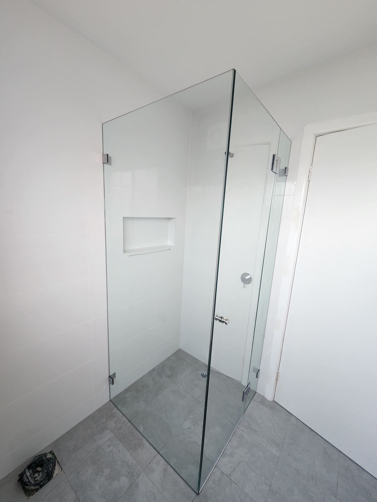 frameless shower screen with chrome hardware installed in Toongabbie by Showerland
