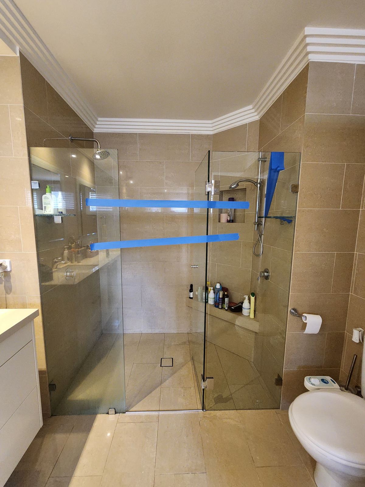 frameless shower screen with chrome hardware installed in Bella Vista by Showerland