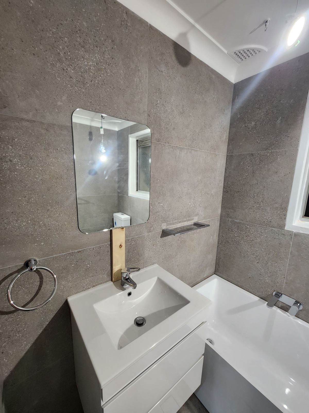 frameless shower screen with chrome hardware installed in Winston Hills by Showerland
