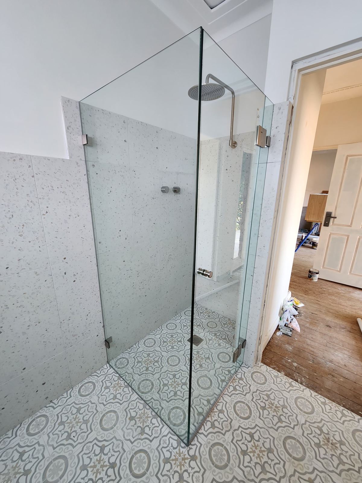 frameless shower screen with chrome hardware installed in Kogarah by Showerland