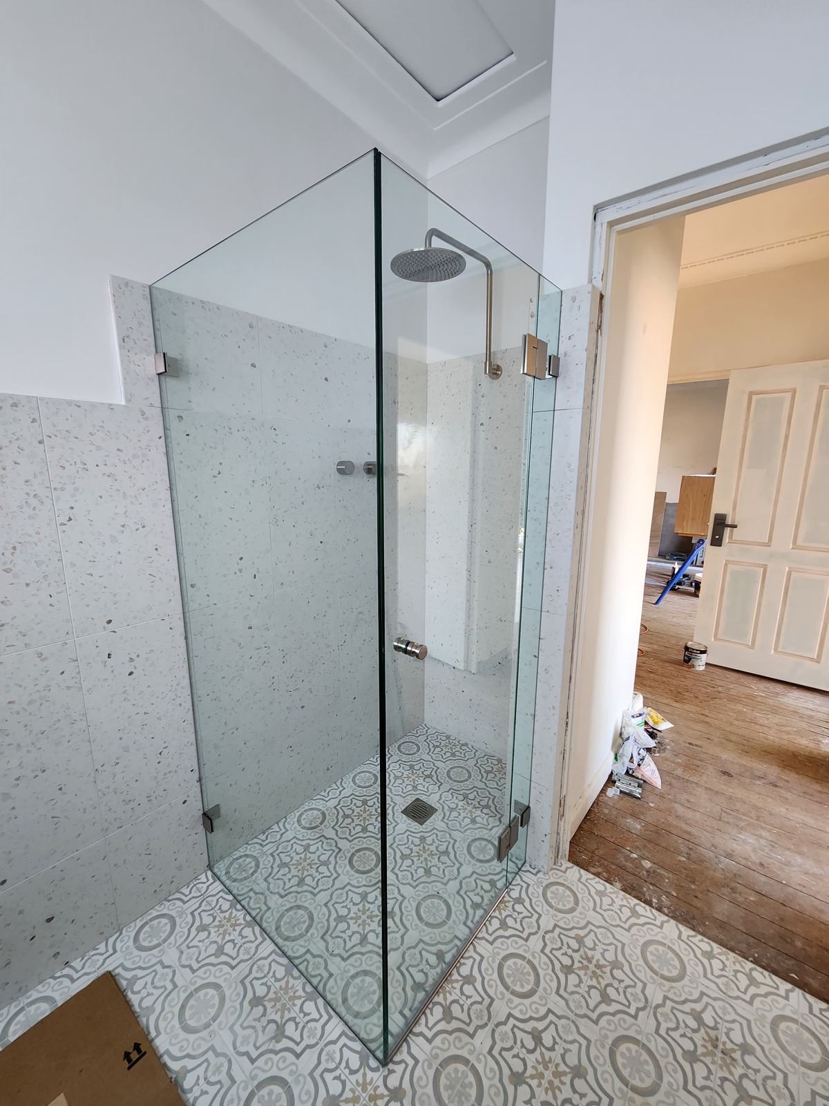 frameless shower screen with chrome hardware installed in Kogarah by Showerland