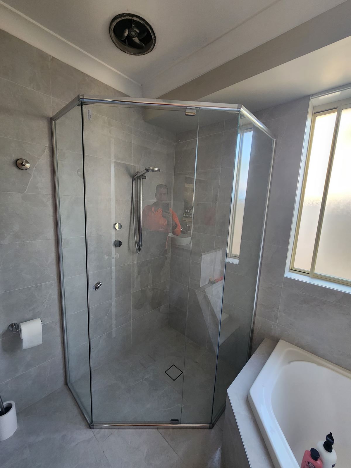 semi shower screen with chrome hardware installed in Horningsea Park by Showerland