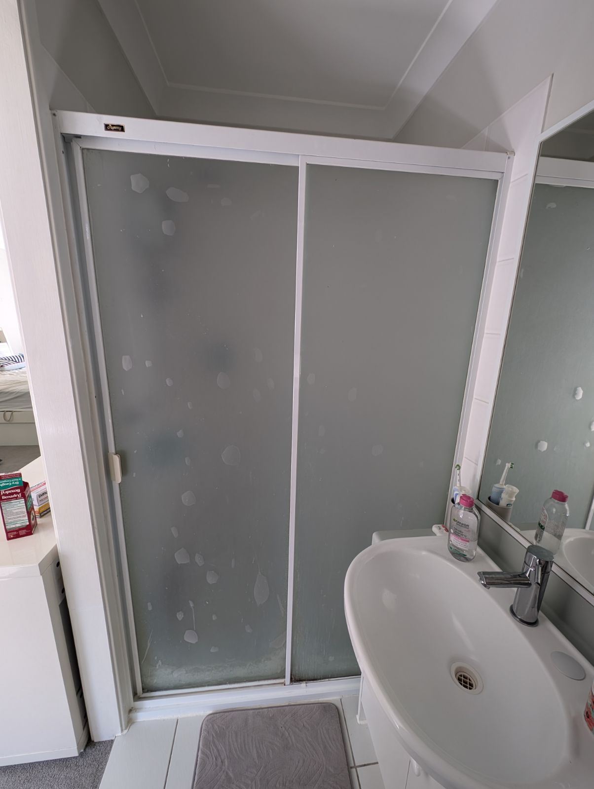 Bathroom before frameless shower screen install in Stanhope Gardens