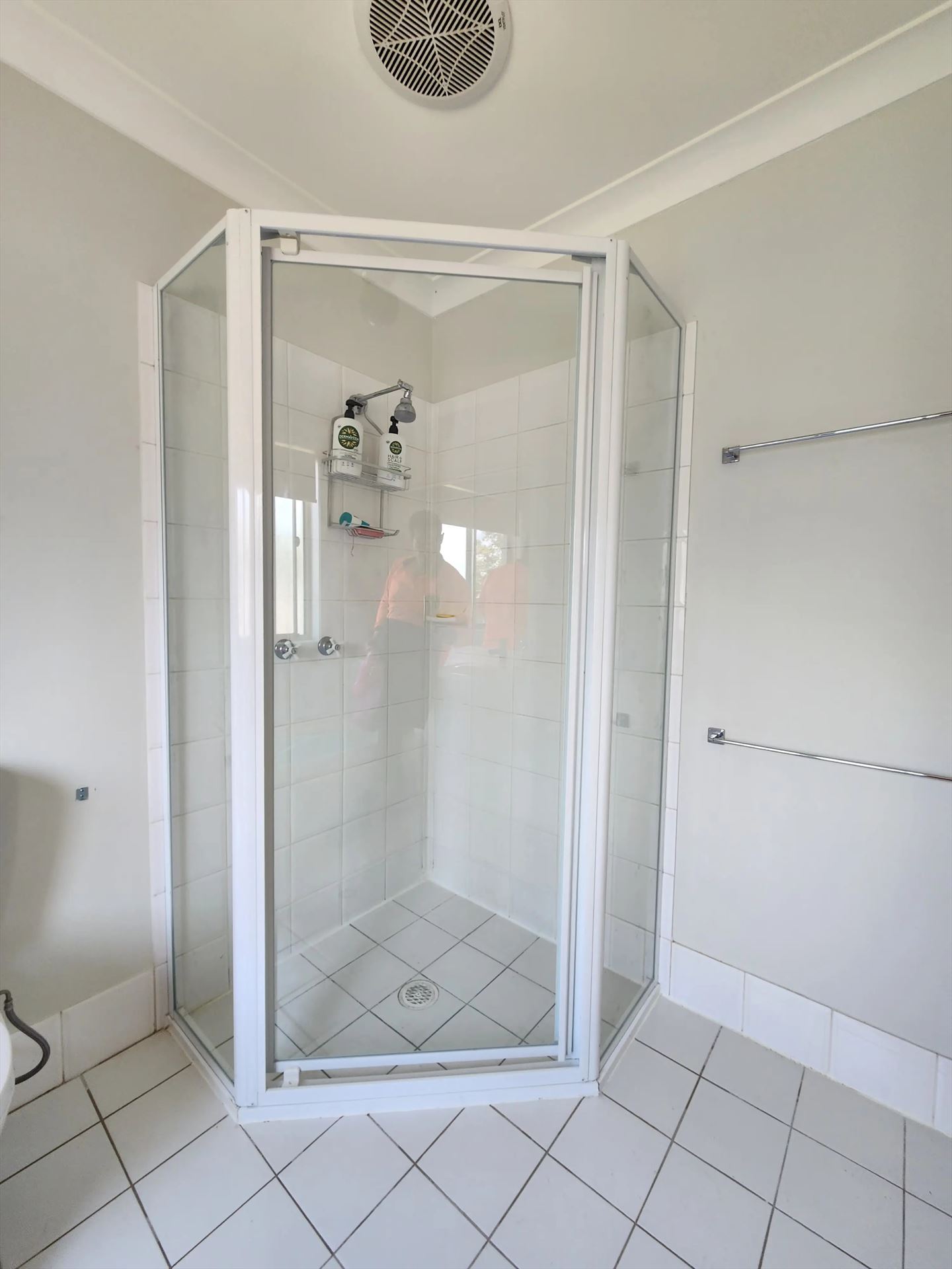 fully shower screen with white hardware installed in Stanhope Gardens by Showerland