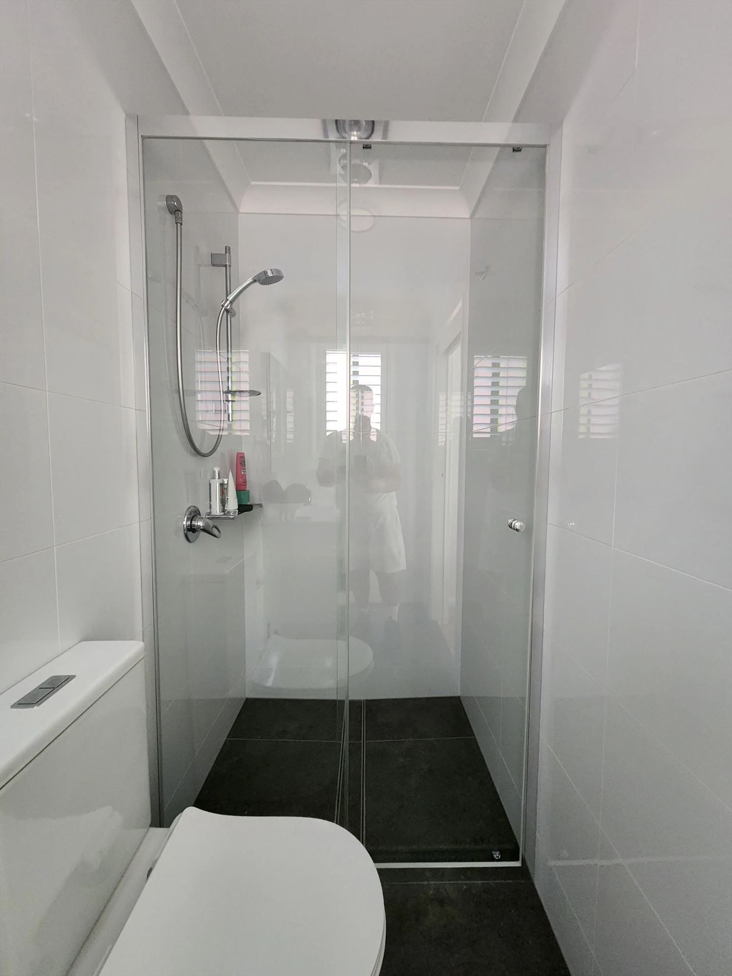 semi shower screen with chrome hardware installed in Baulkham Hills by Showerland
