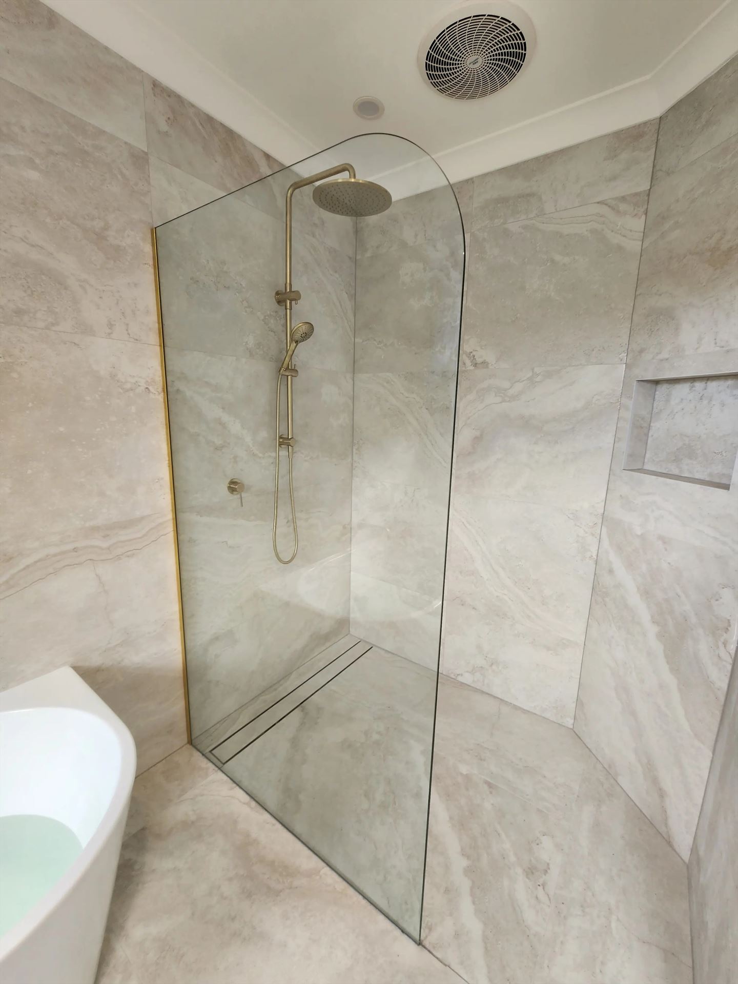 frameless shower screen with gold hardware installed in Kenthurst by Showerland