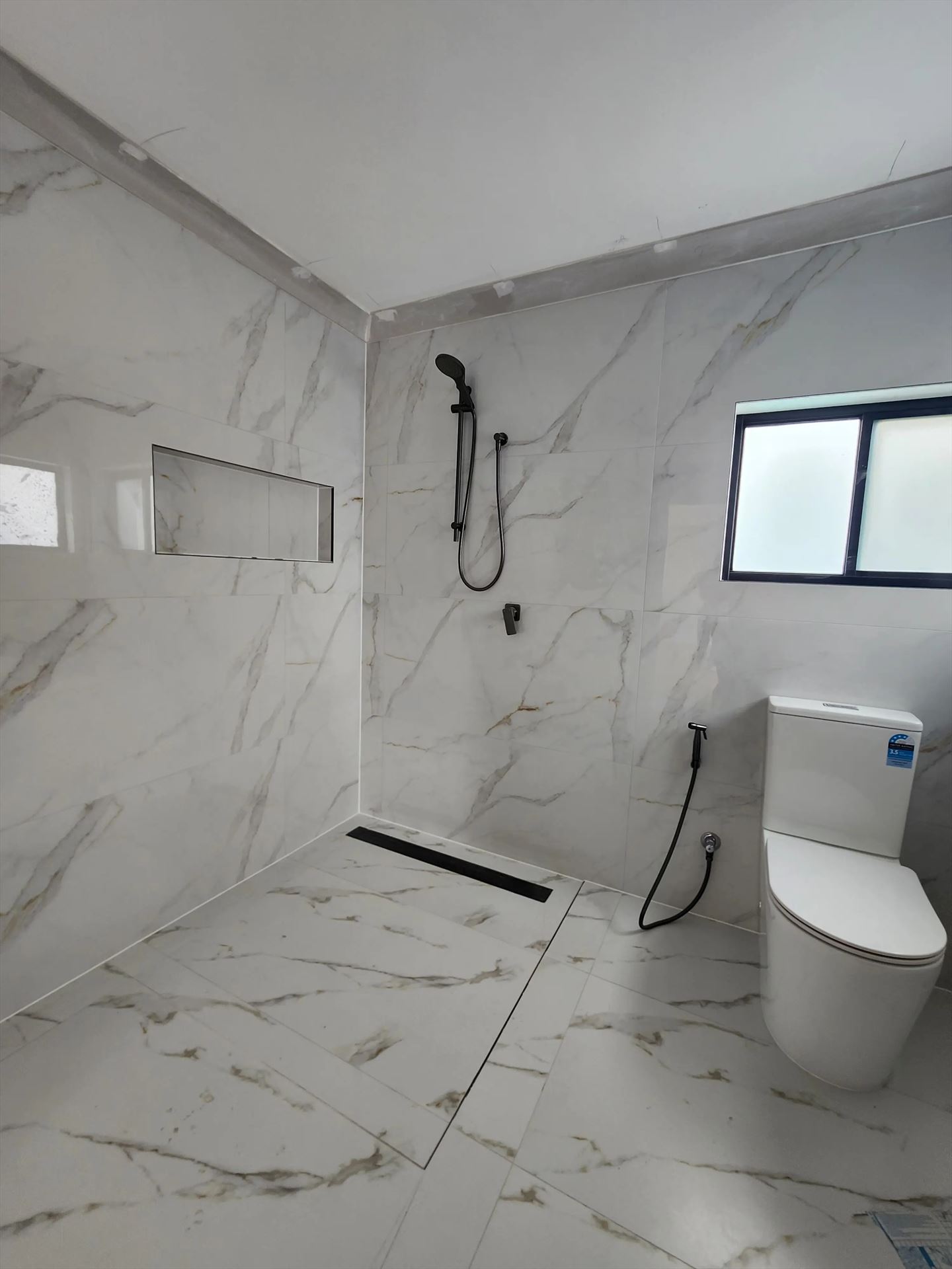 Bathroom before frameless shower screen install in Glenwood