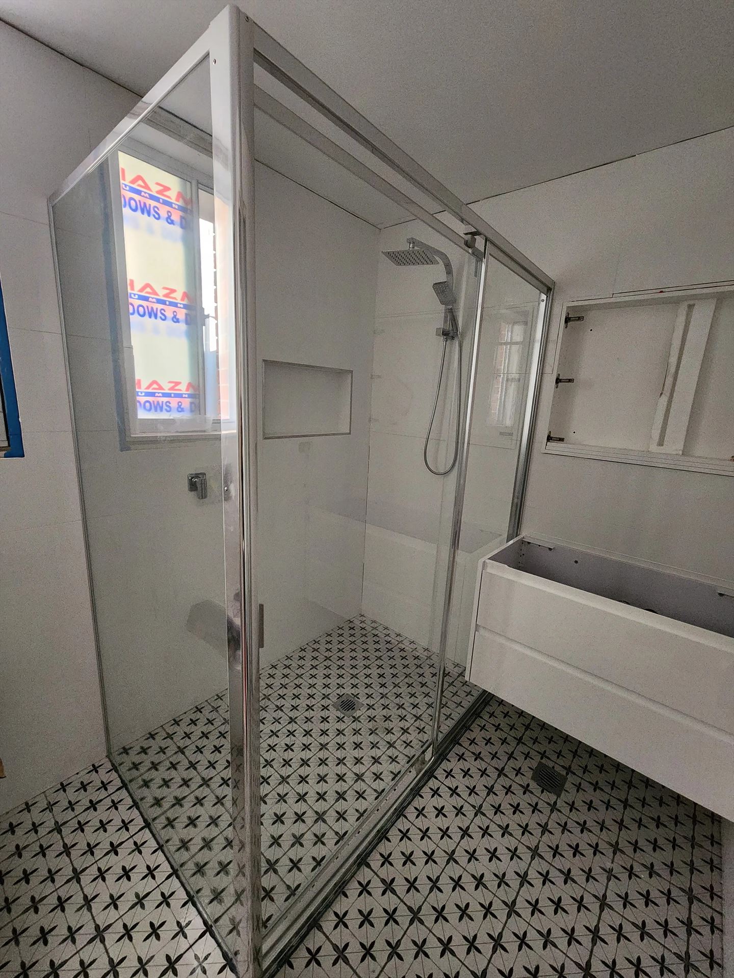 fully shower screen with chrome hardware installed in Peakhurst by Showerland