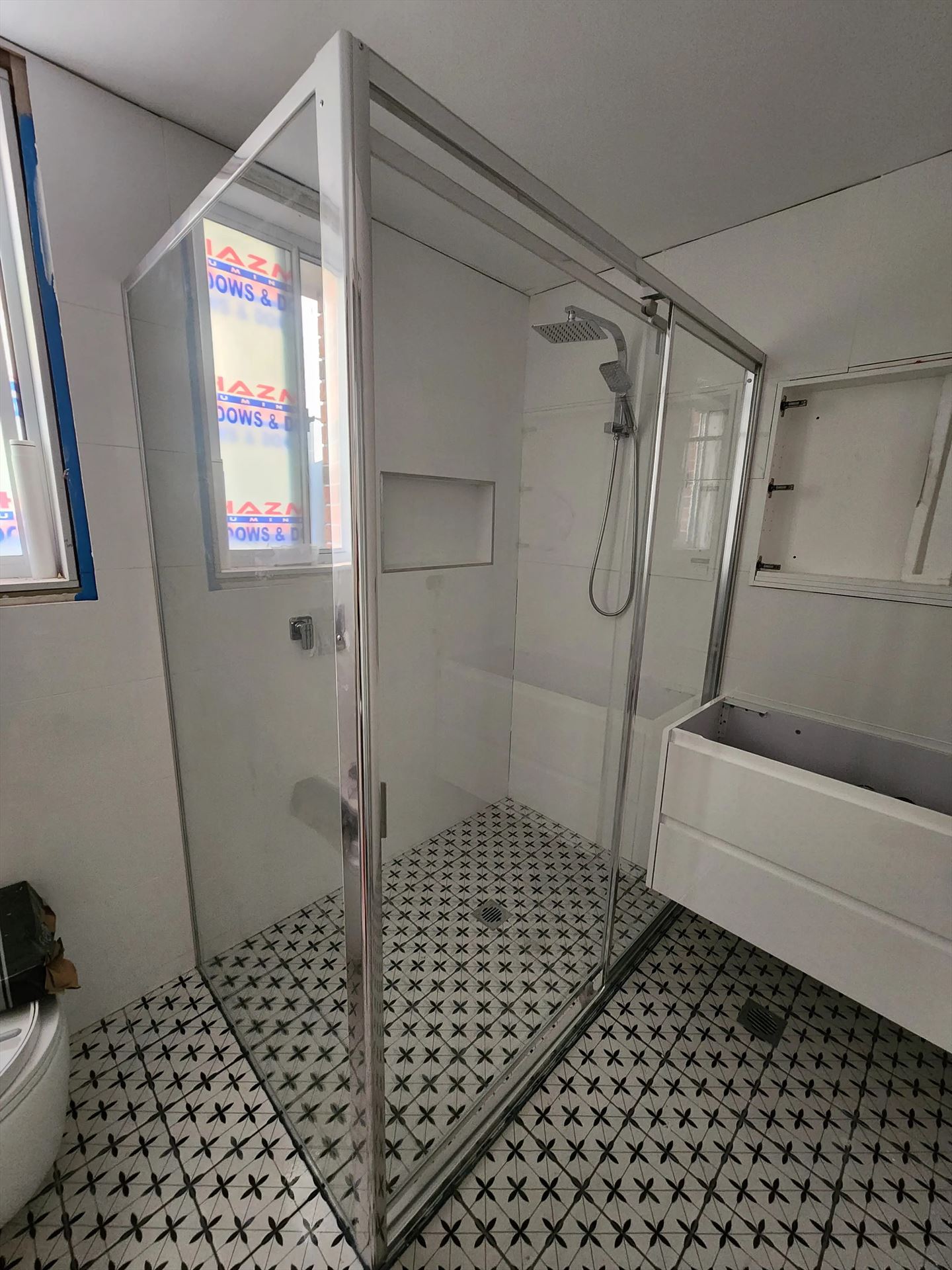 fully shower screen with chrome hardware installed in Peakhurst by Showerland
