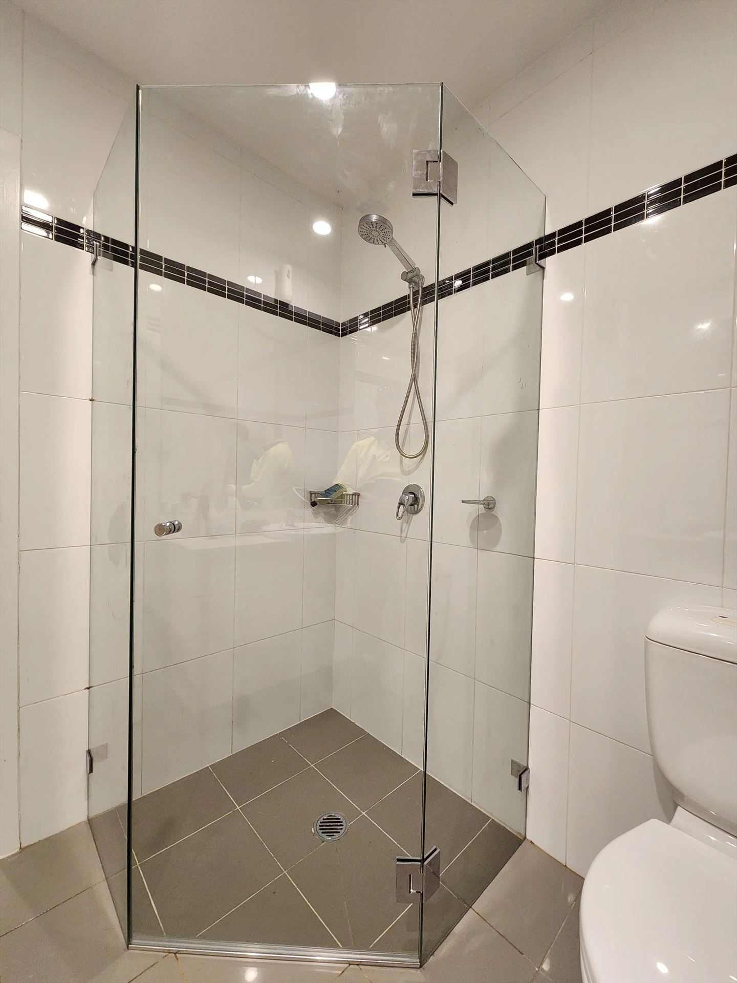 frameless shower screen with chrome hardware installed in Mascot by Showerland