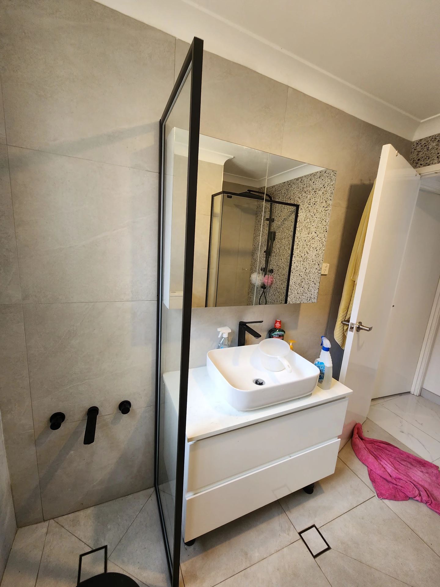 semi shower screen with black hardware installed in Mount Druitt by Showerland