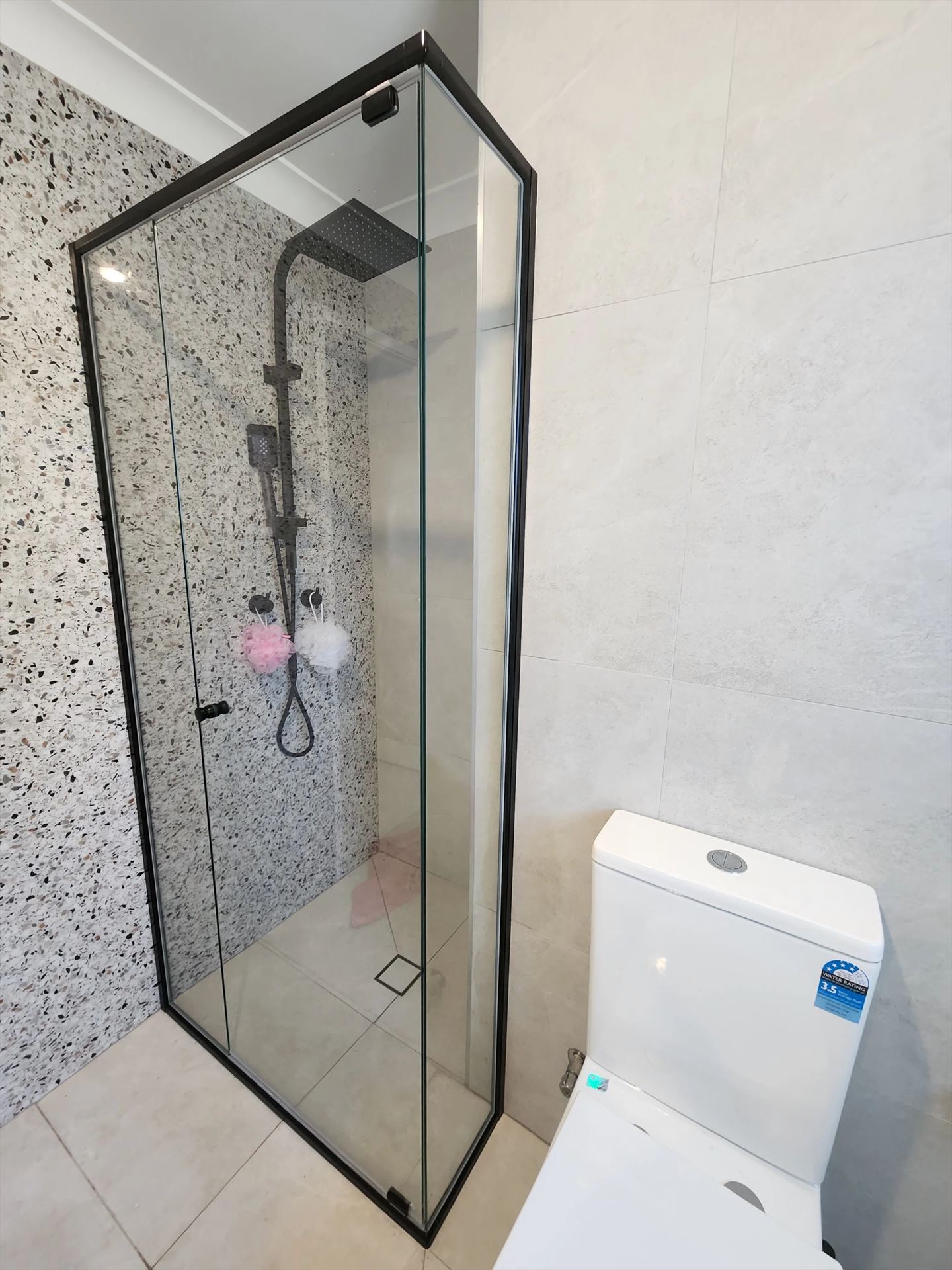 semi shower screen with black hardware installed in Mount Druitt by Showerland