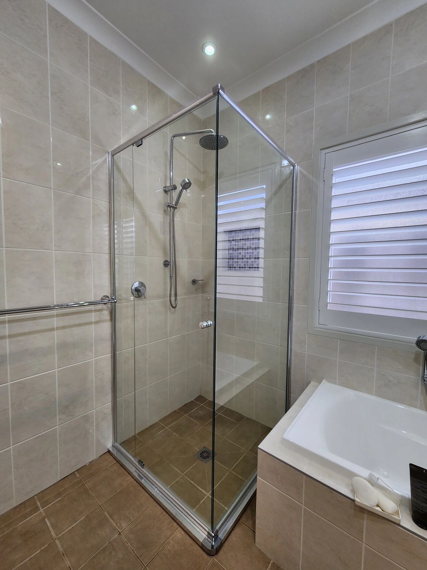 semi shower screen with chrome hardware installed in The Ponds by Showerland