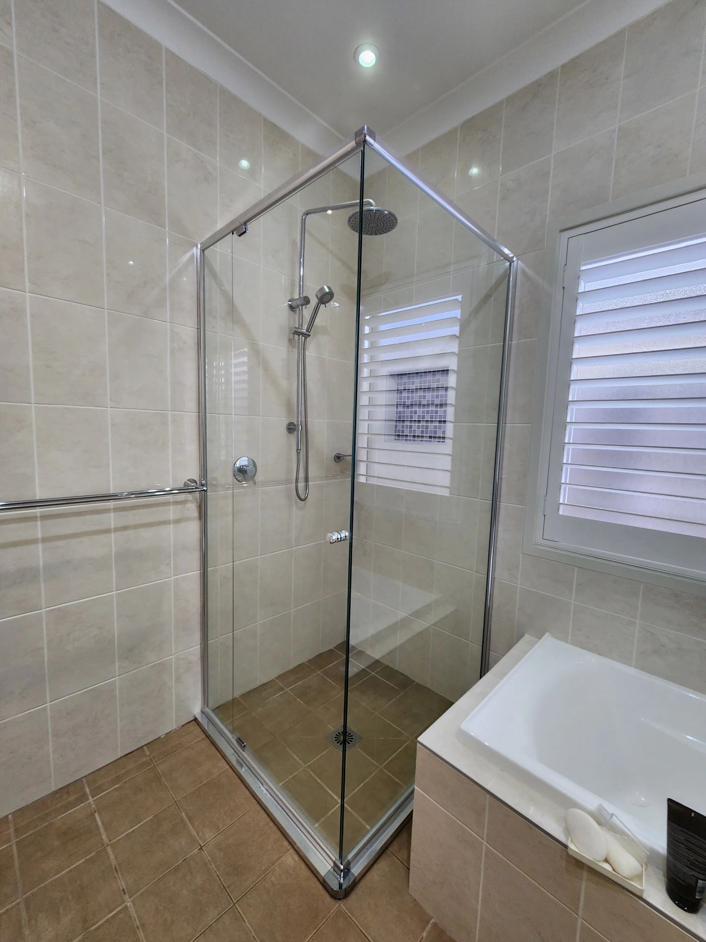 semi shower screen with chrome hardware installed in The Ponds by Showerland