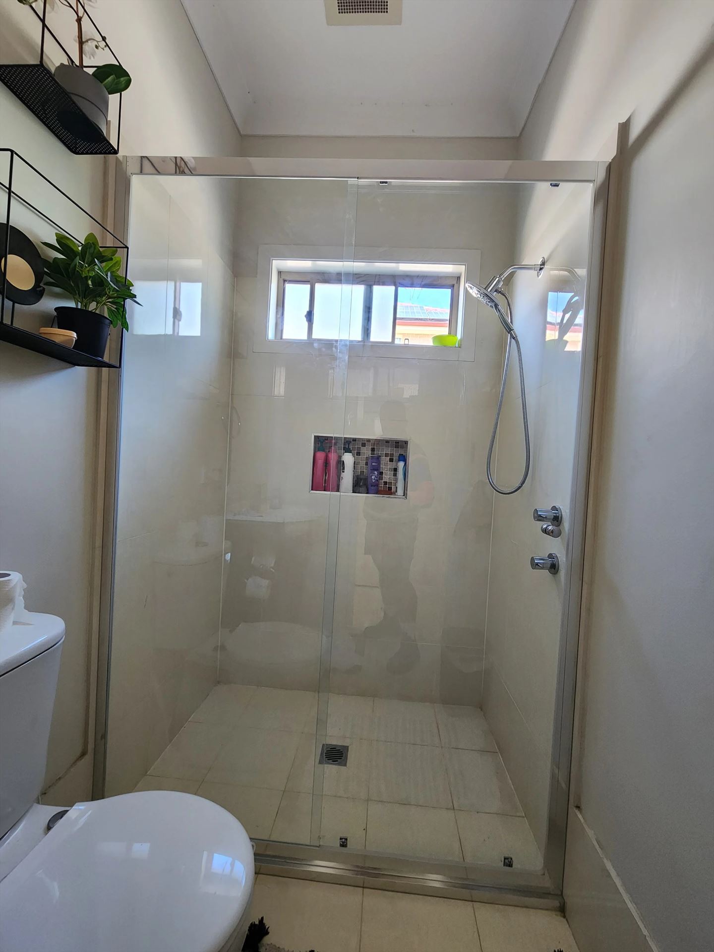 semi shower screen with chrome hardware installed in Woodcroft by Showerland