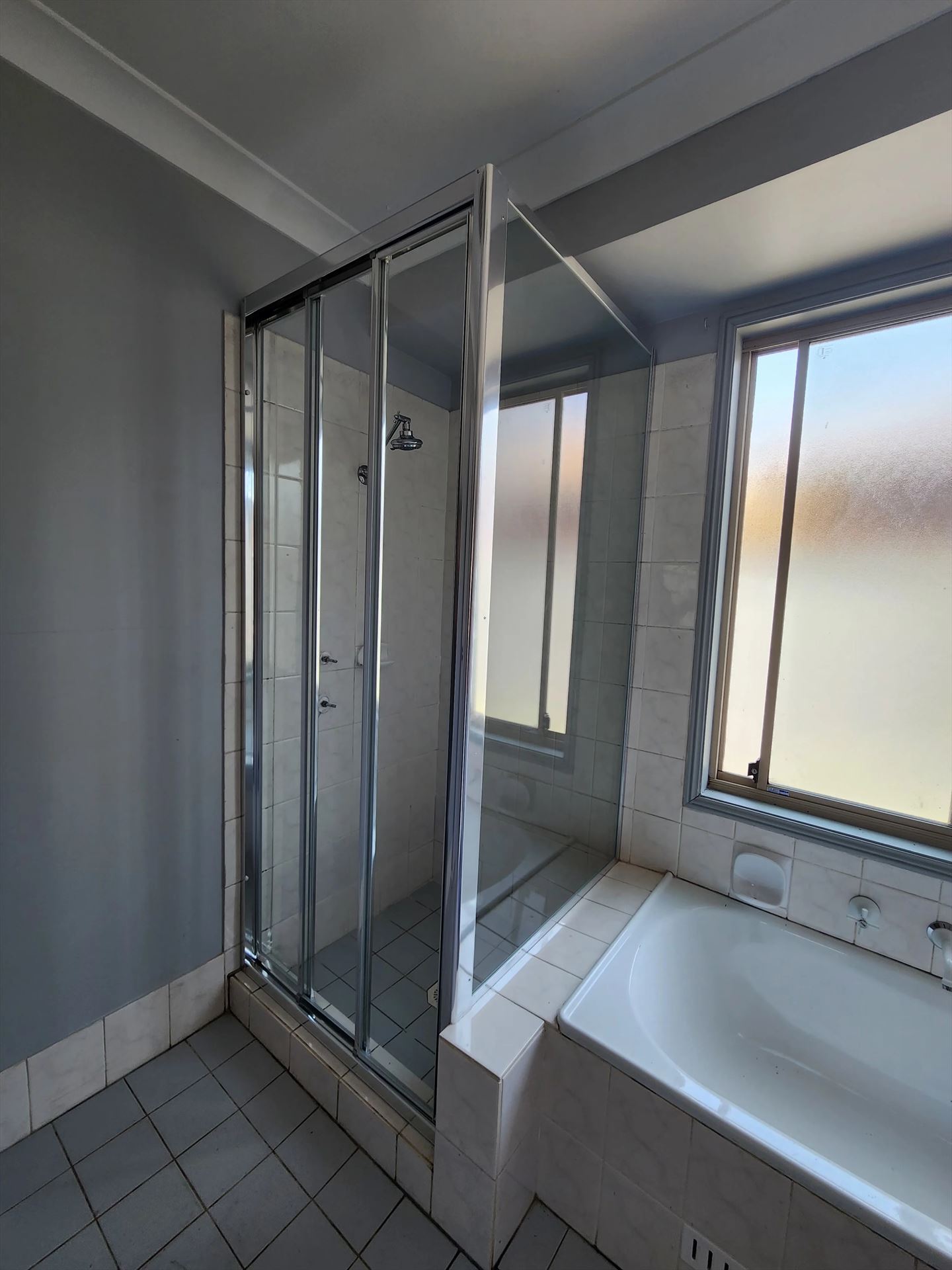 fully shower screen with chrome hardware installed in Glendenning by Showerland