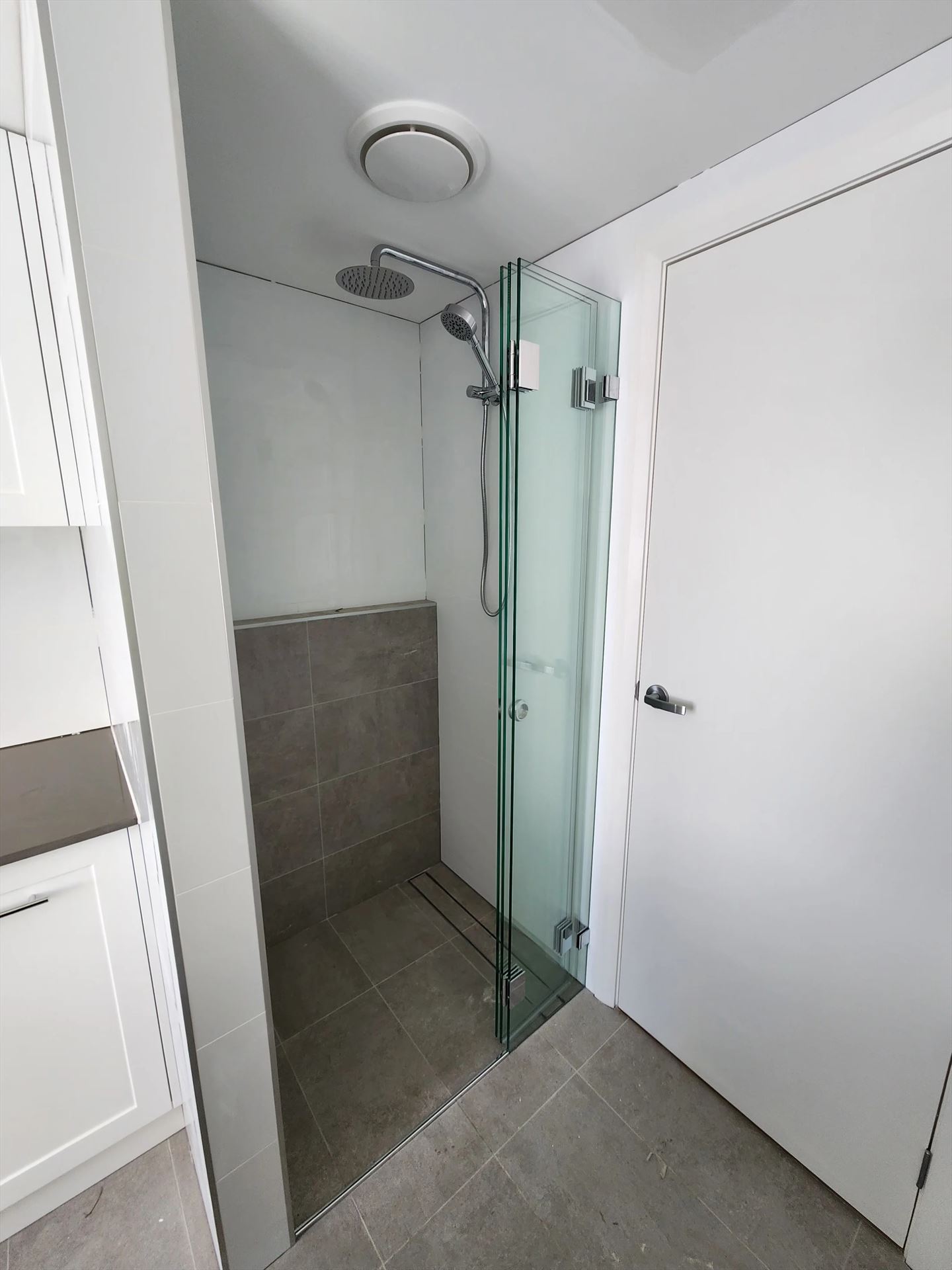 frameless shower screen with chrome hardware installed in Blacktown by Showerland