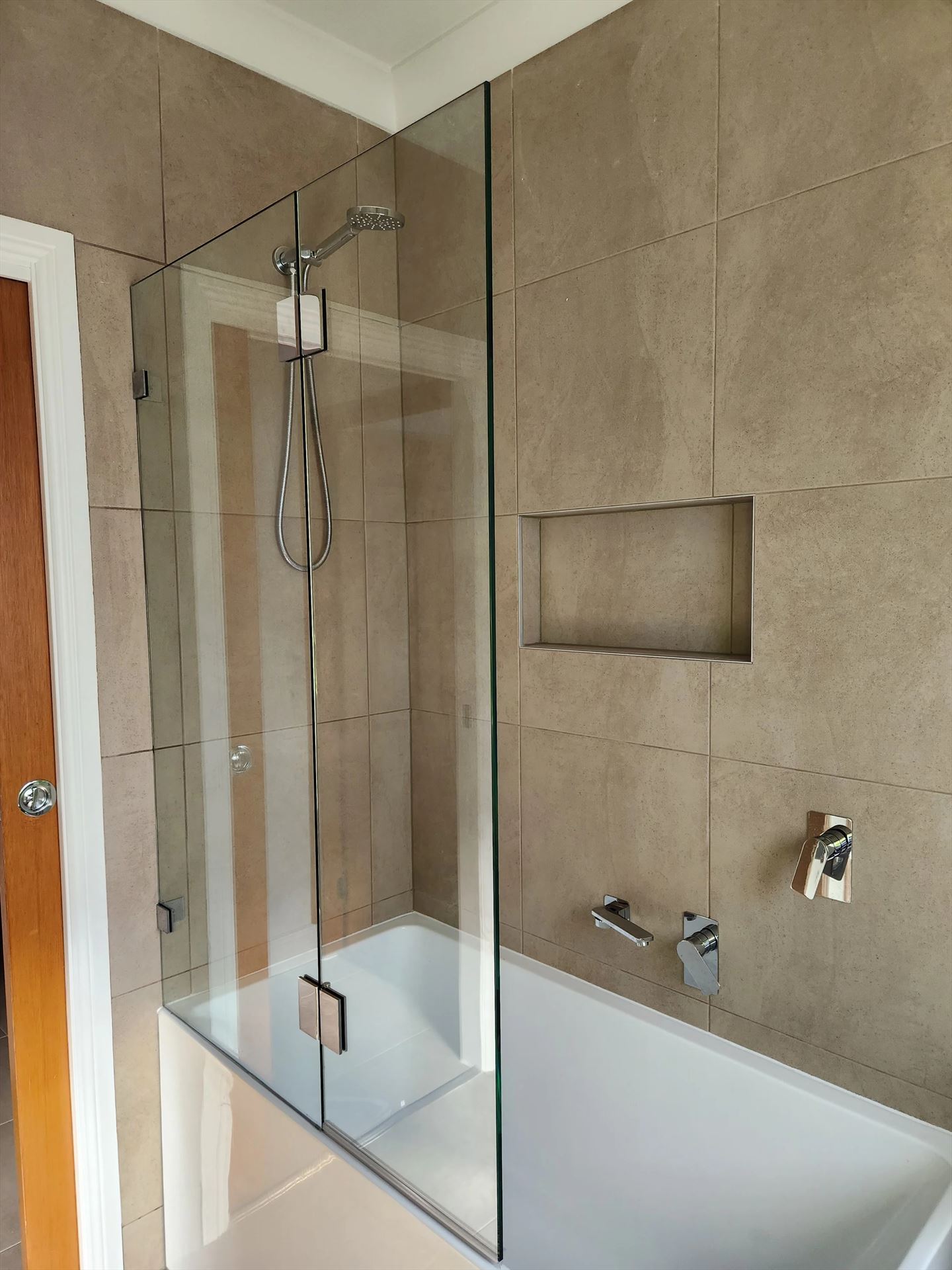 frameless shower screen with chrome hardware installed in Seven Hills by Showerland