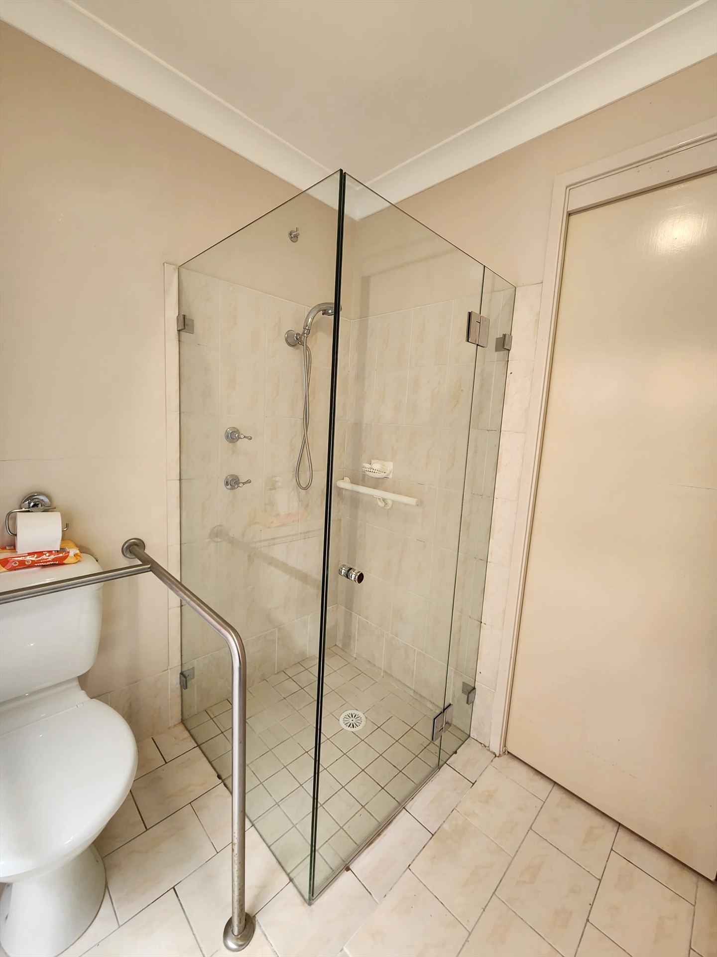 frameless shower screen with chrome hardware installed in Erskine Park by Showerland