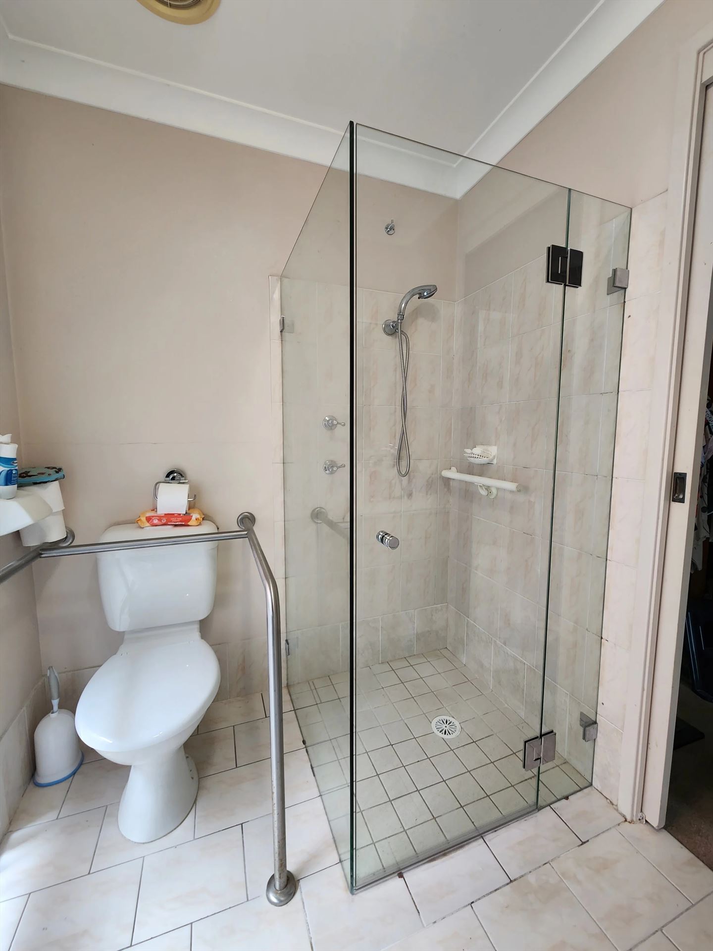 frameless shower screen with chrome hardware installed in Erskine Park by Showerland