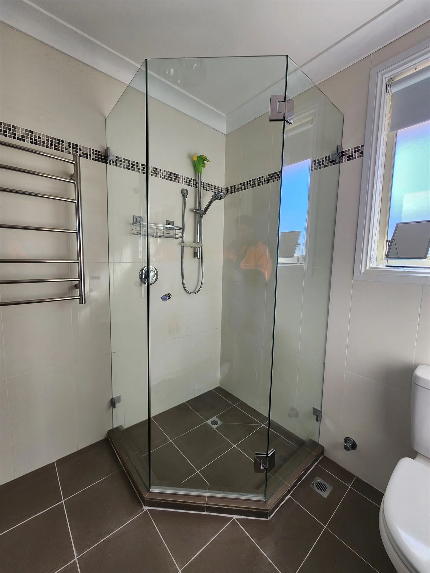 frameless shower screen with chrome hardware installed in Castle Hill by Showerland