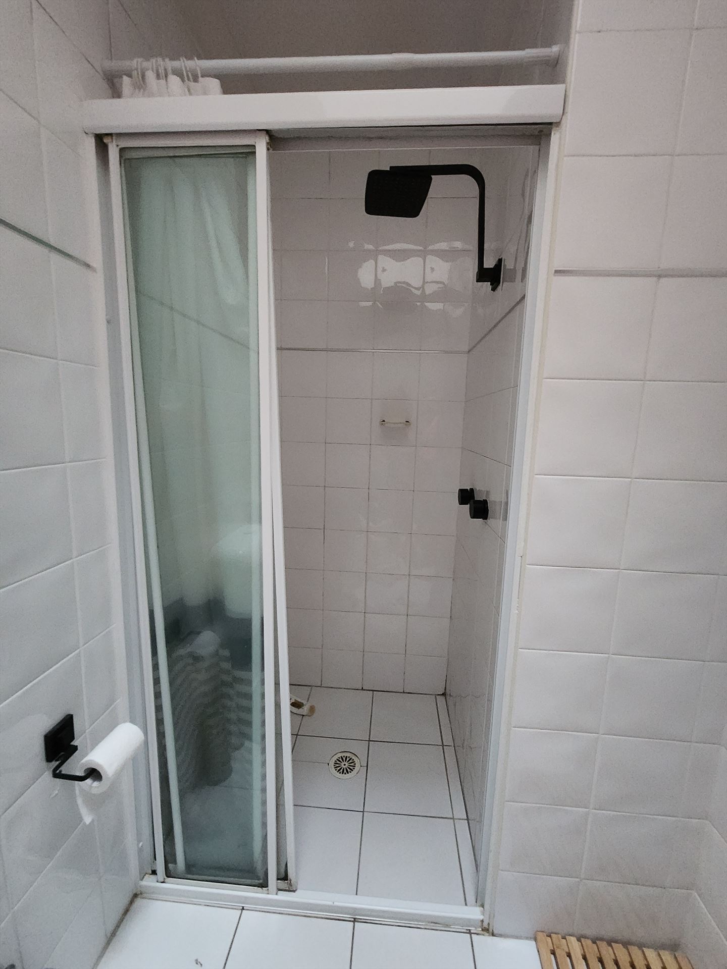Bathroom before frameless shower screen install in Ryde