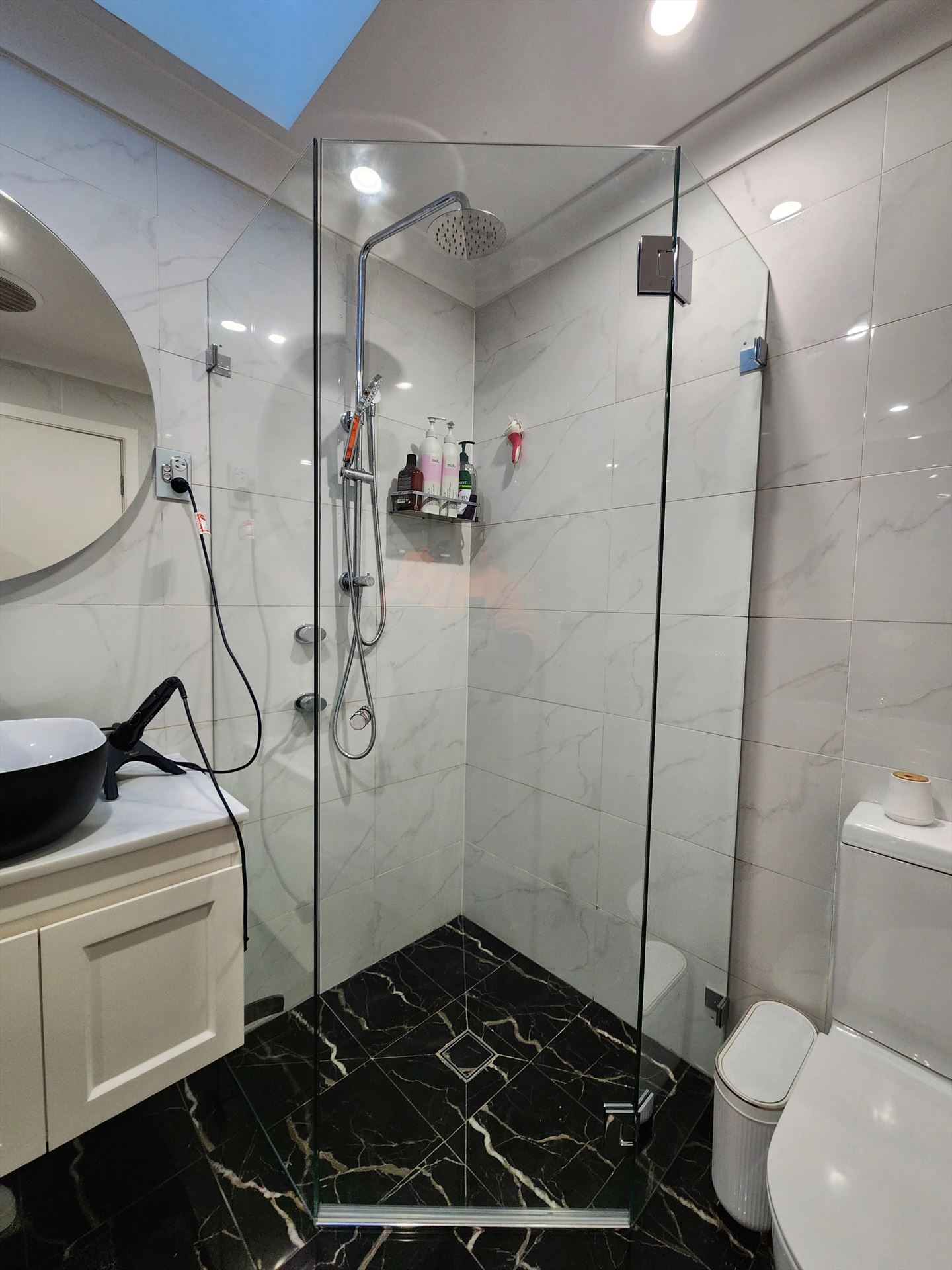 frameless shower screen with chrome hardware installed in Newington by Showerland