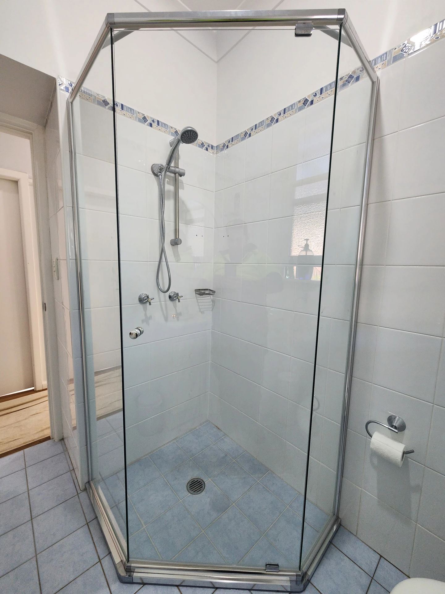 semi shower screen with chrome hardware installed in Lalor Park by Showerland