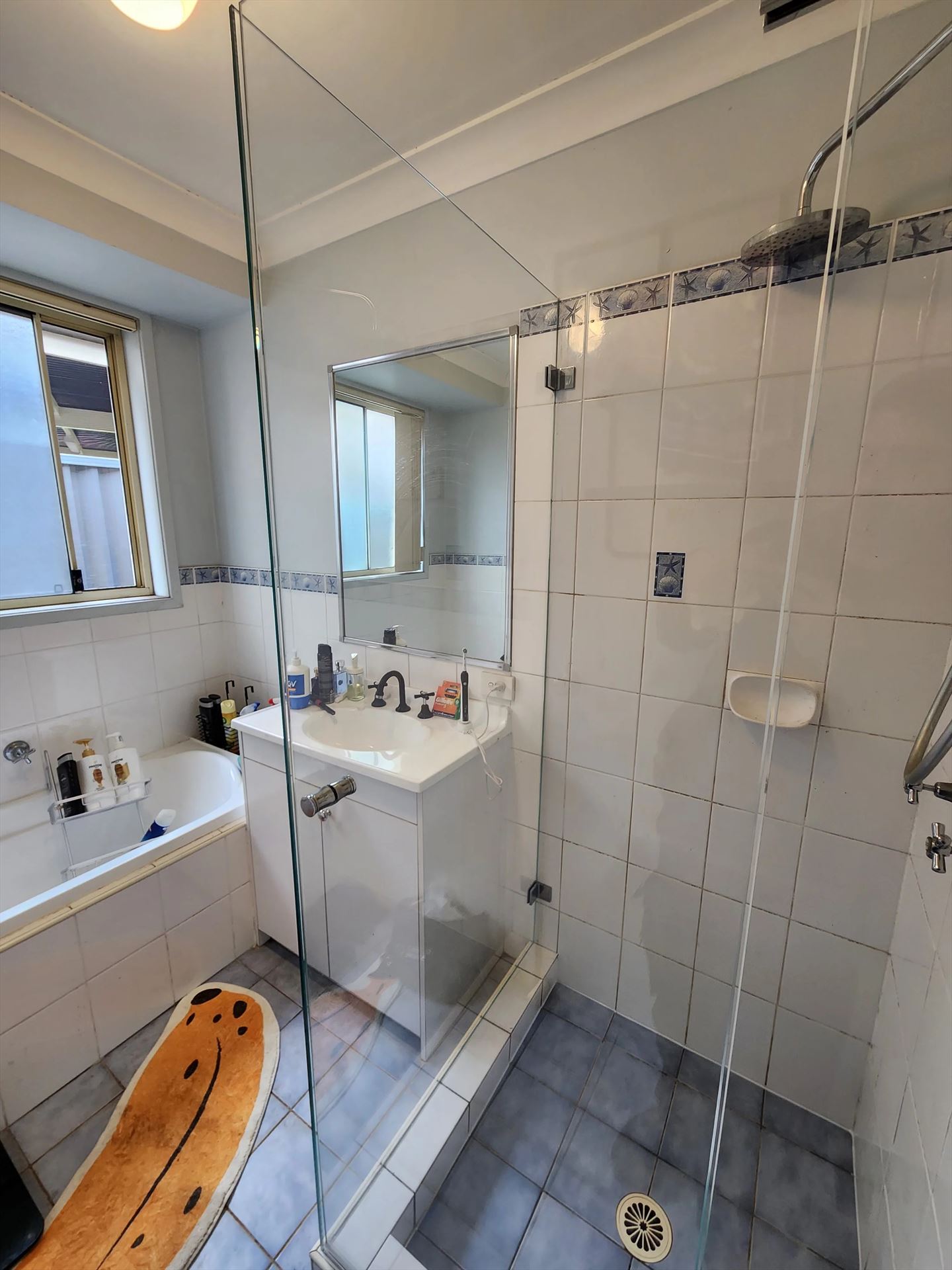 frameless shower screen with chrome hardware installed in Lalor Park by Showerland