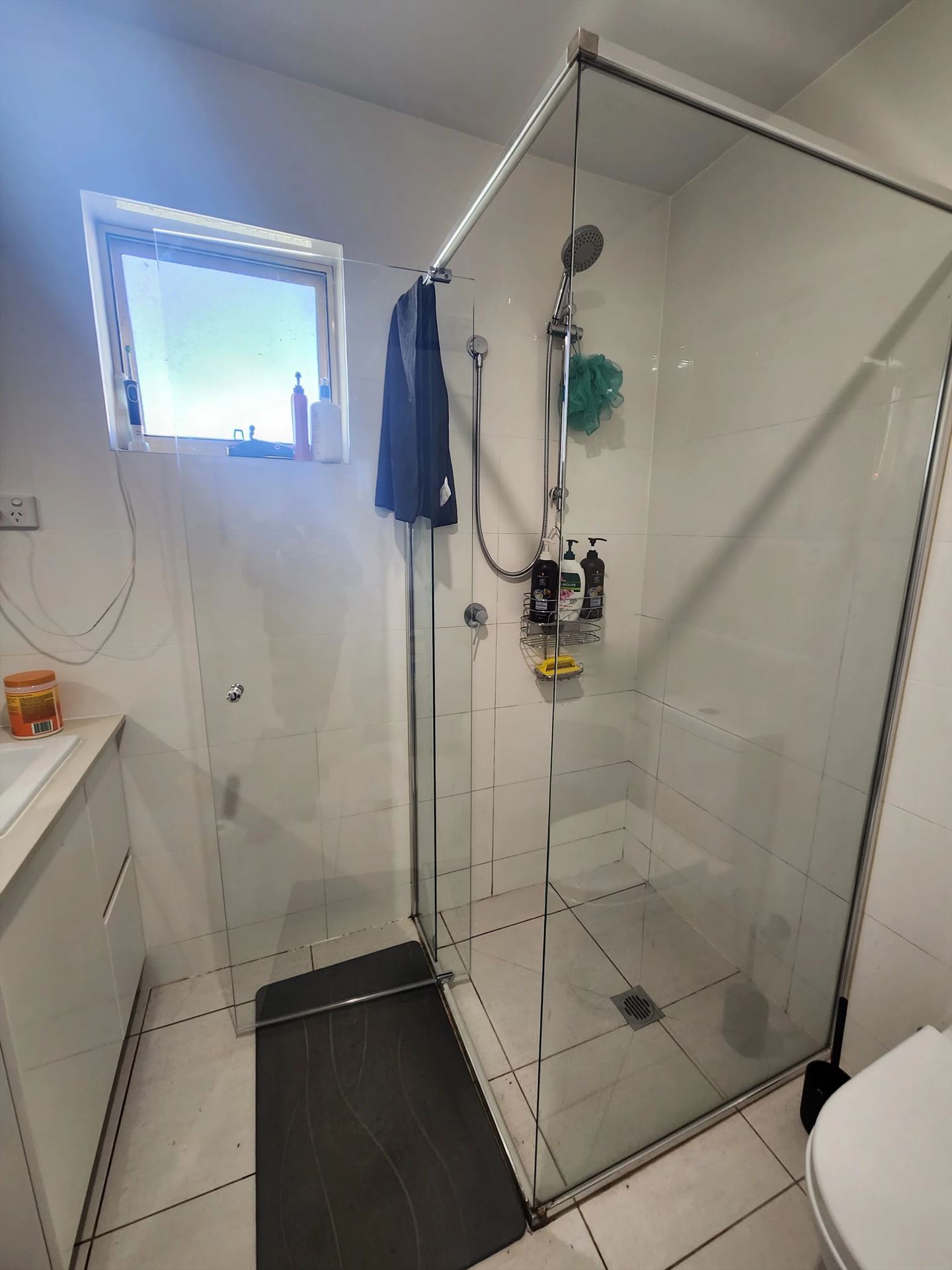 semi shower screen with chrome hardware installed in Glendenning by Showerland