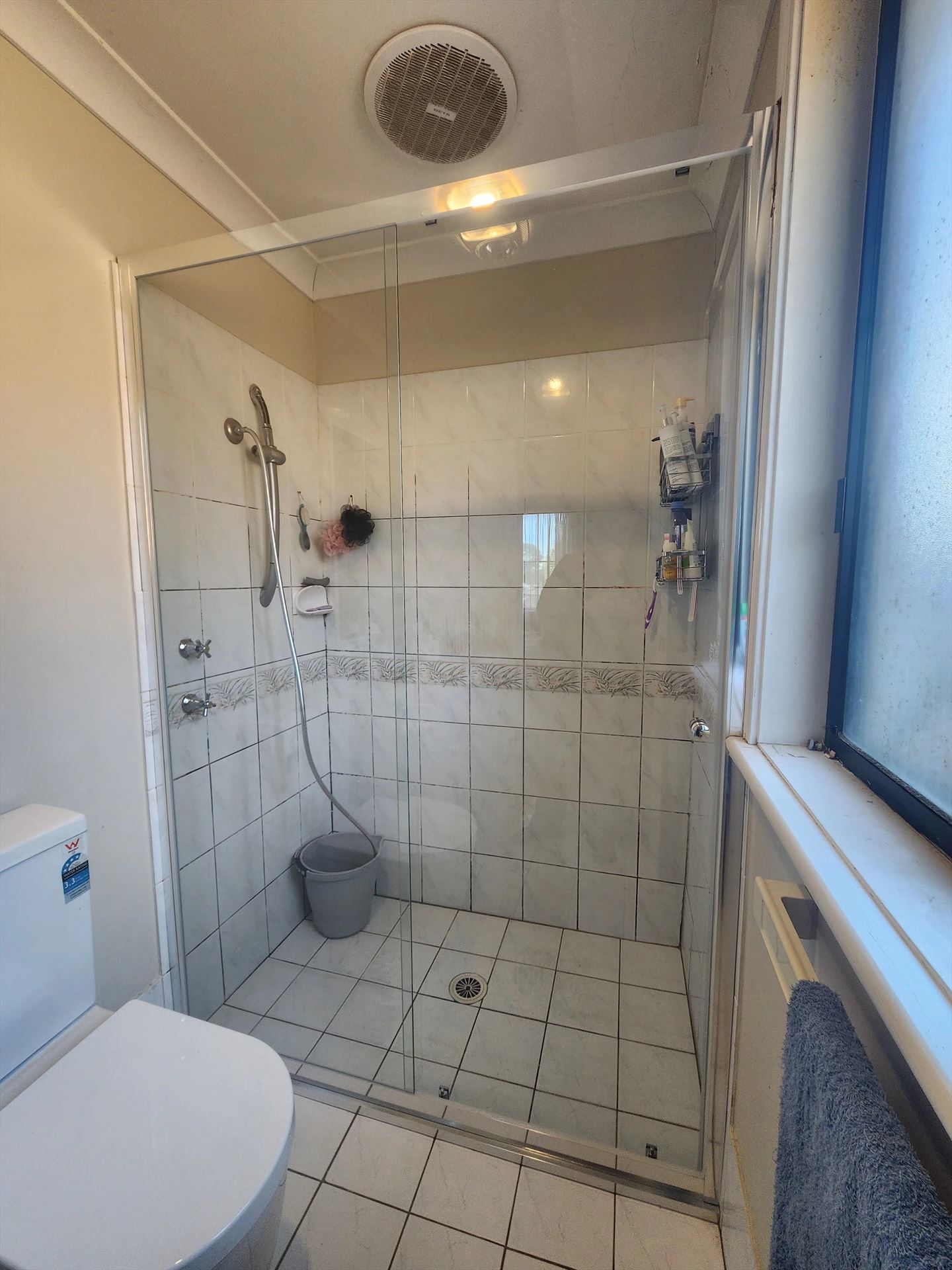 semi shower screen with chrome hardware installed in Glenwood by Showerland