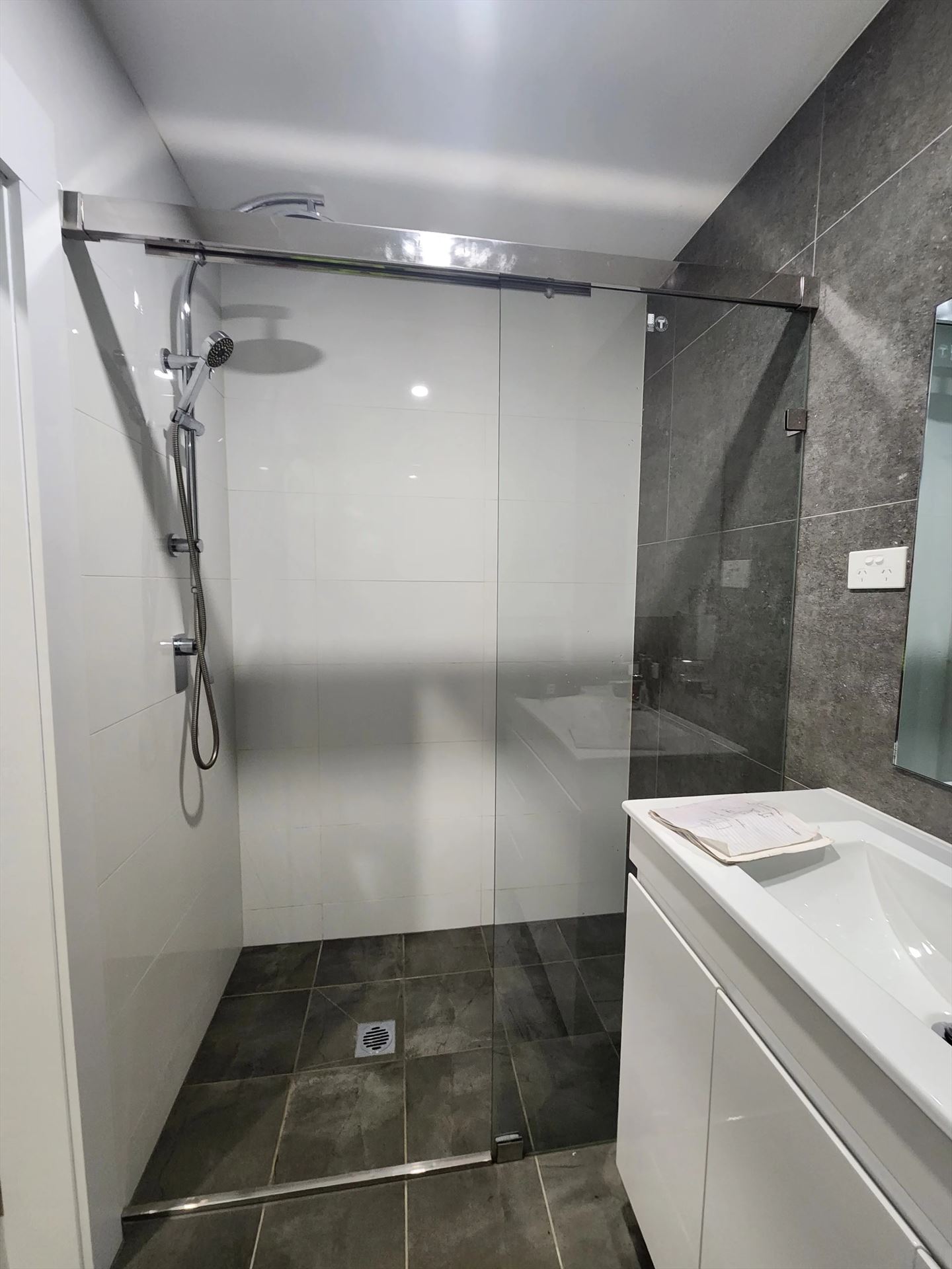 frameless shower screen with chrome hardware installed in Punchbowl by Showerland