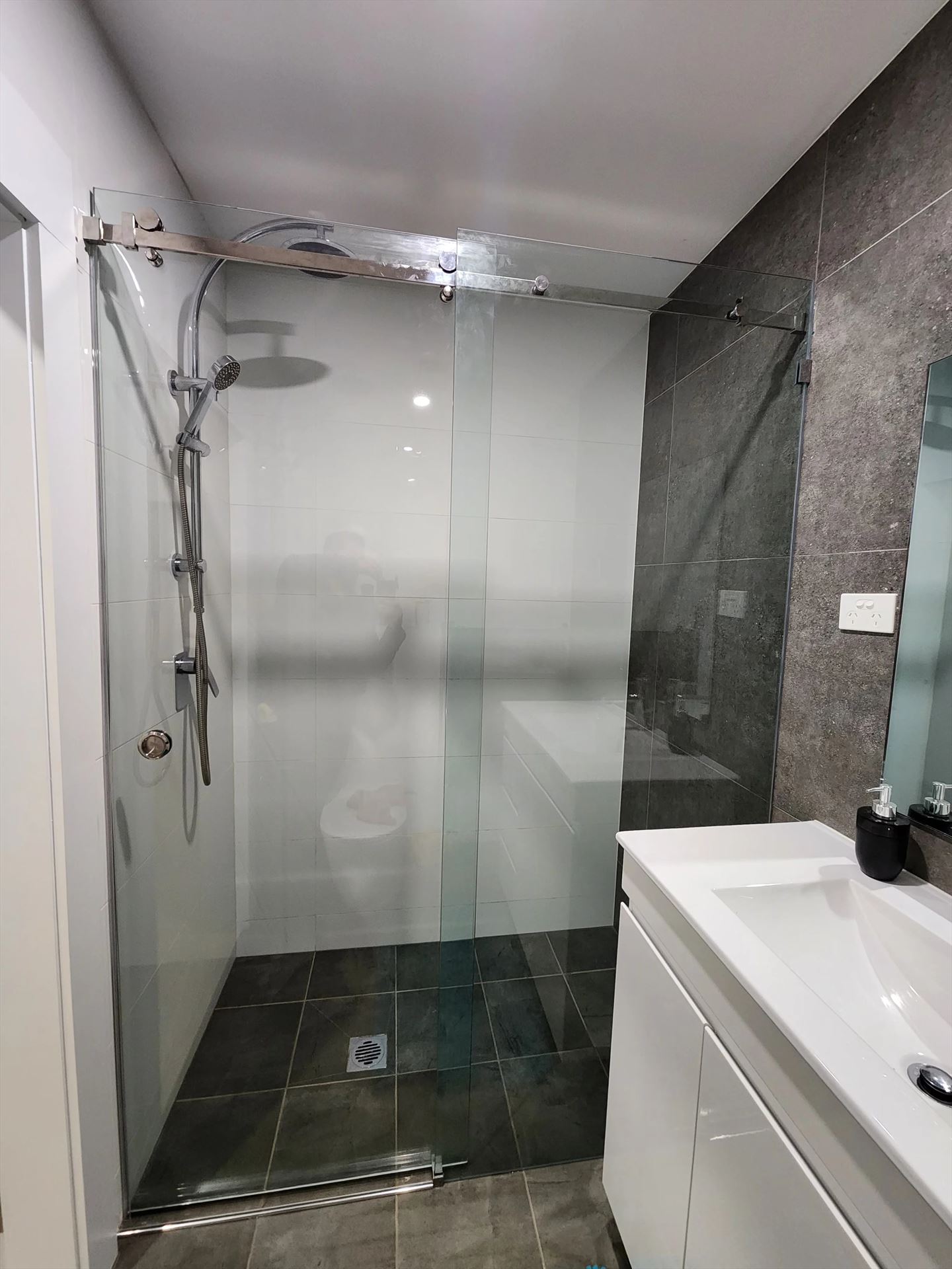 frameless shower screen with chrome hardware installed in Punchbowl by Showerland