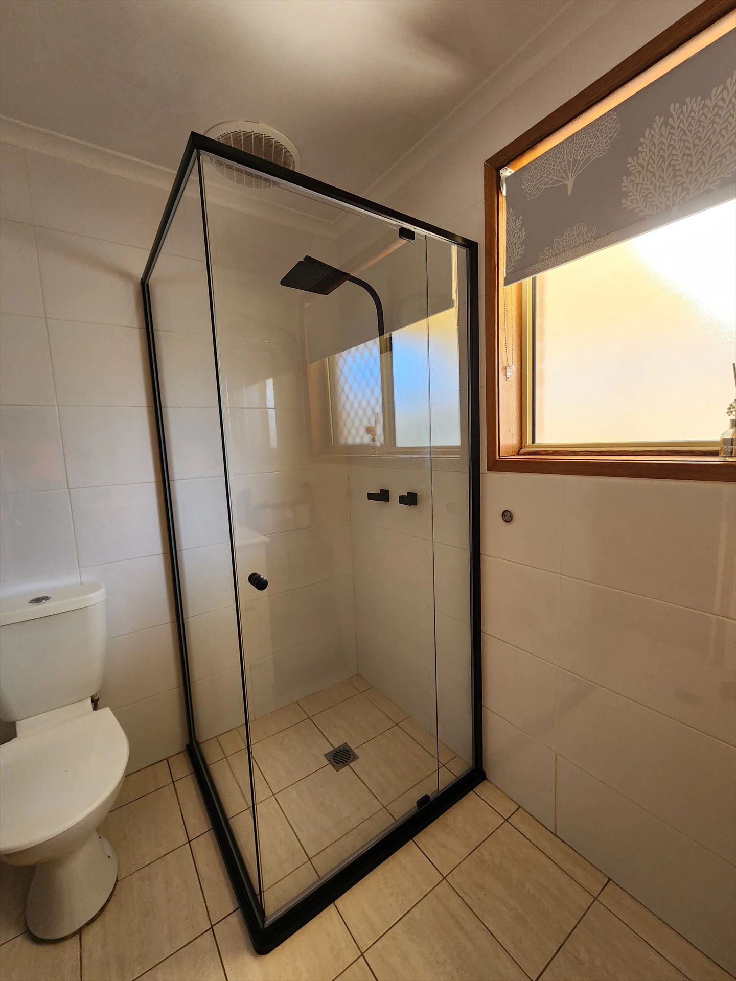 semi shower screen with black hardware installed in Cranebrook by Showerland