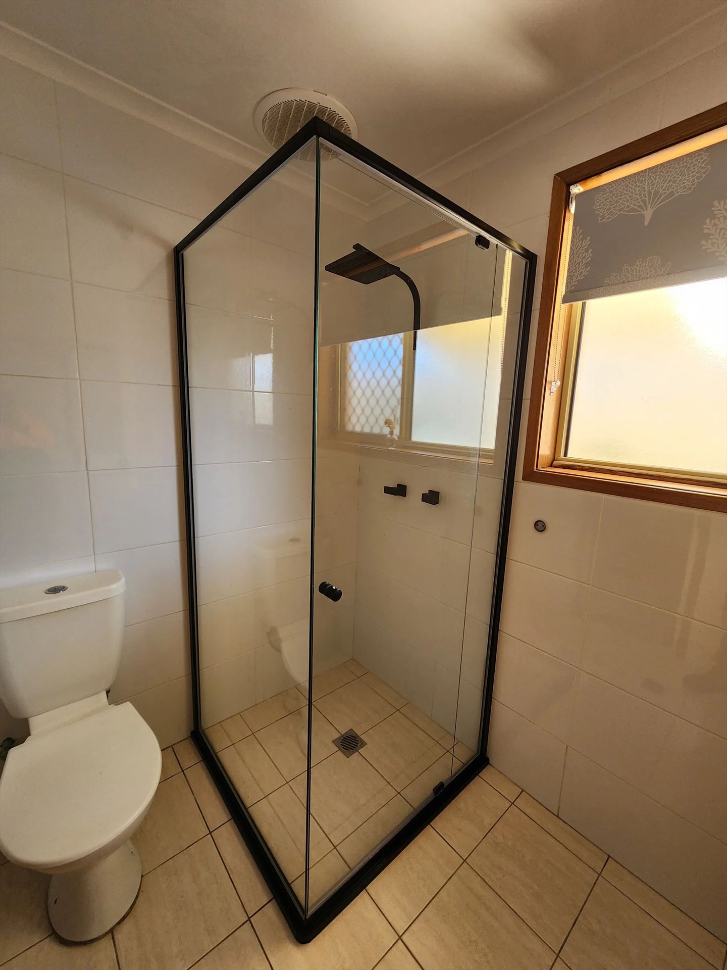 semi shower screen with black hardware installed in Cranebrook by Showerland