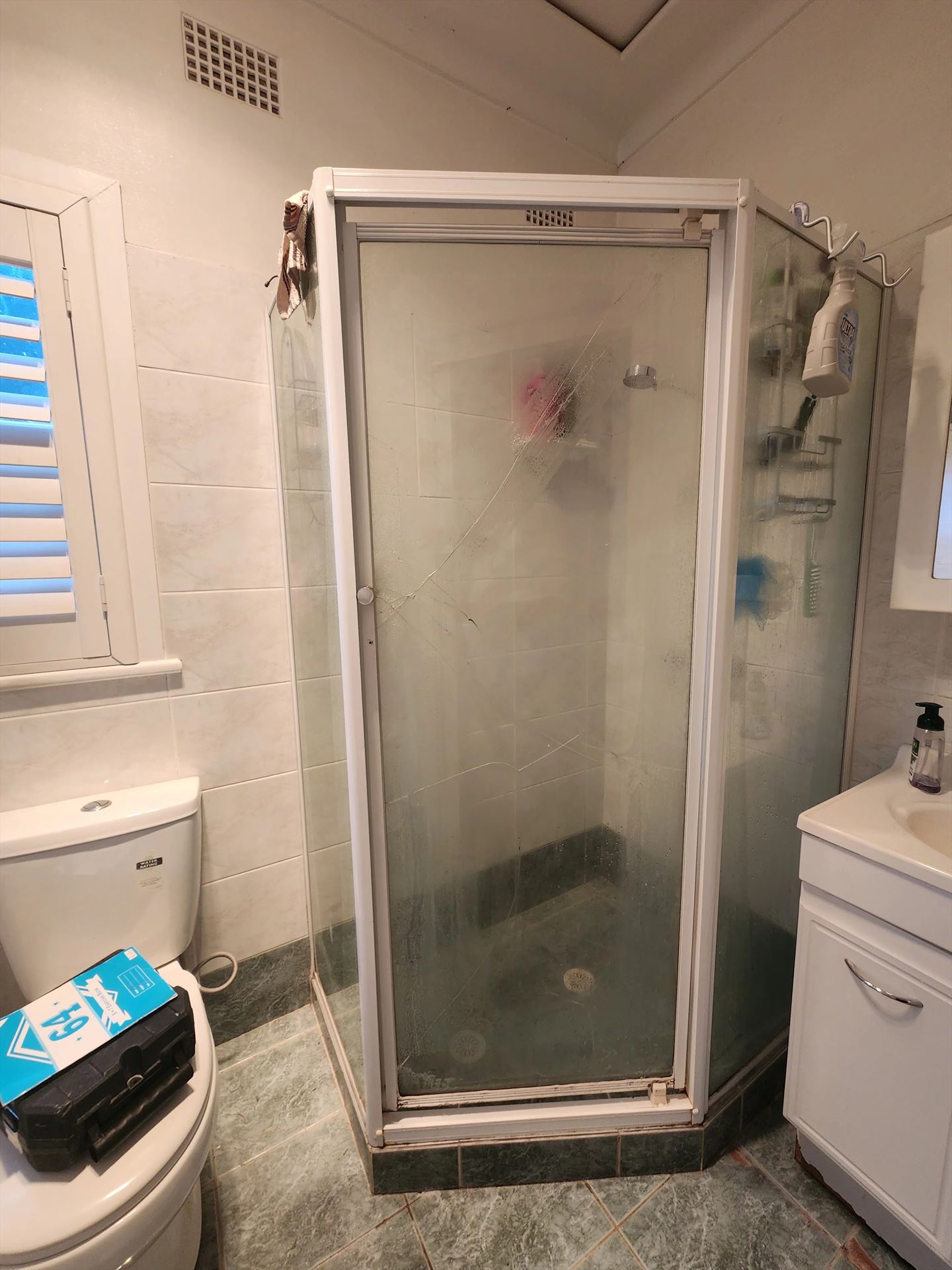 fully shower screen with white hardware installed in Constitution Hill by Showerland